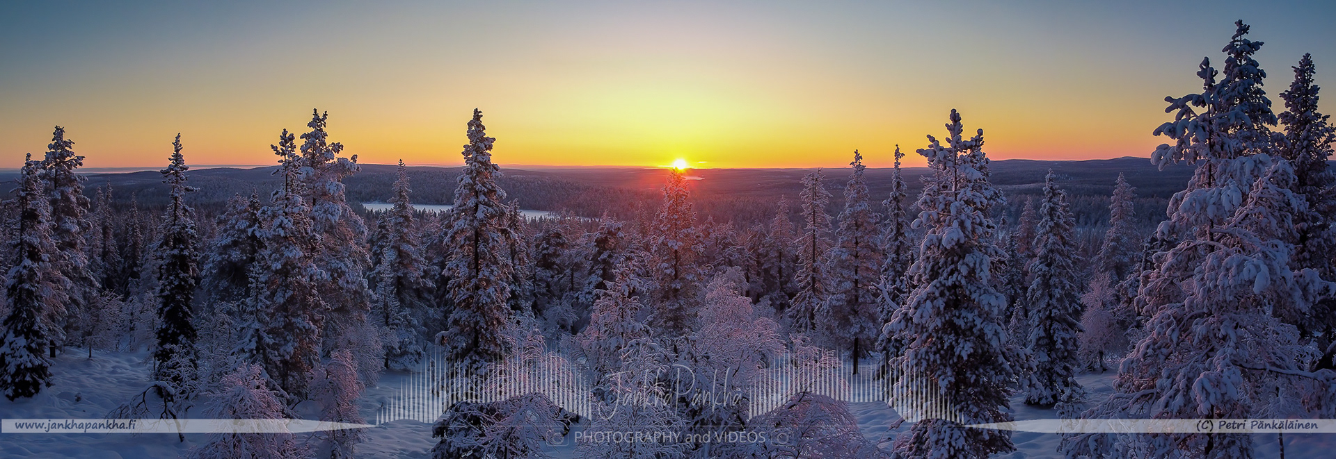 Serene landscape of Pallas-Yllästunturi National Park with a colorful sunset. The photo is taken from the Scenic Road, Maisematie, viewpoint.