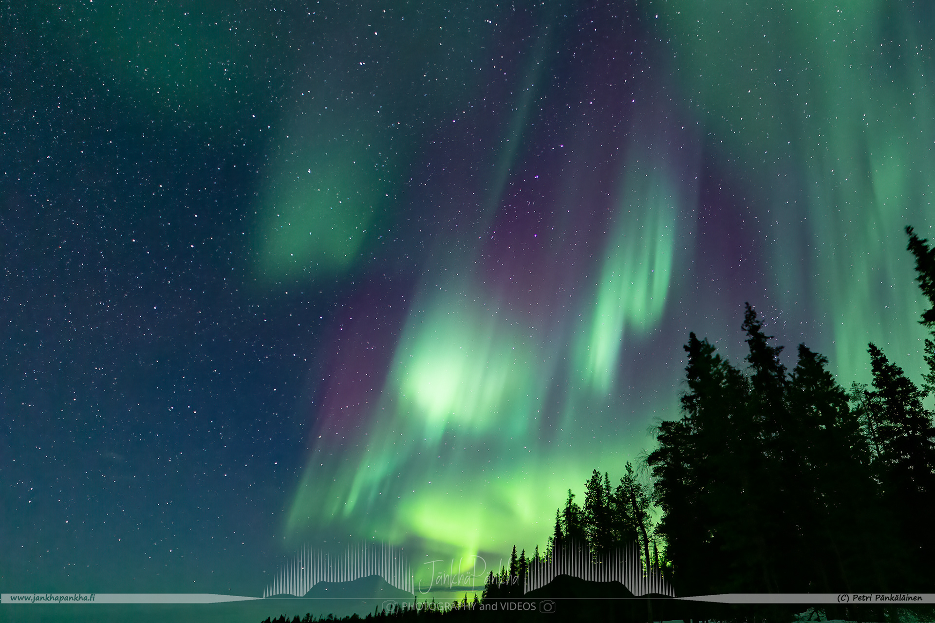 Full sky northern lights corona over the lake Pallasjärvi in Finland. The photo is from the Punainenhiekka hut. The  Punainenhiekka Day-use Hut is situated at the south end of Lake Pallasjärvi.