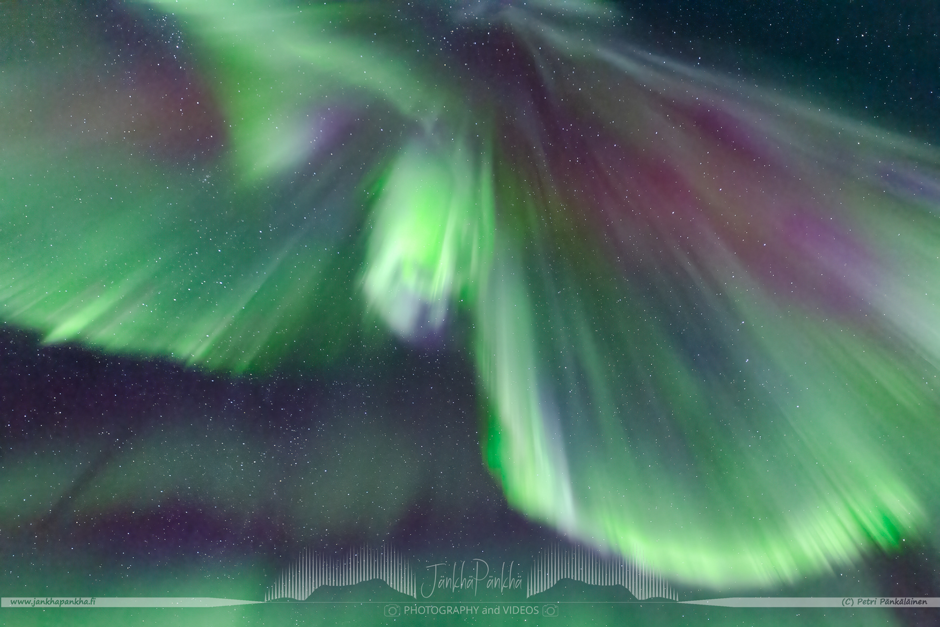 Full sky northern lights corona over the lake Pallasjärvi in Finland. The photo is from the Punainenhiekka hut. The  Punainenhiekka Day-use Hut is situated at the south end of Lake Pallasjärvi.