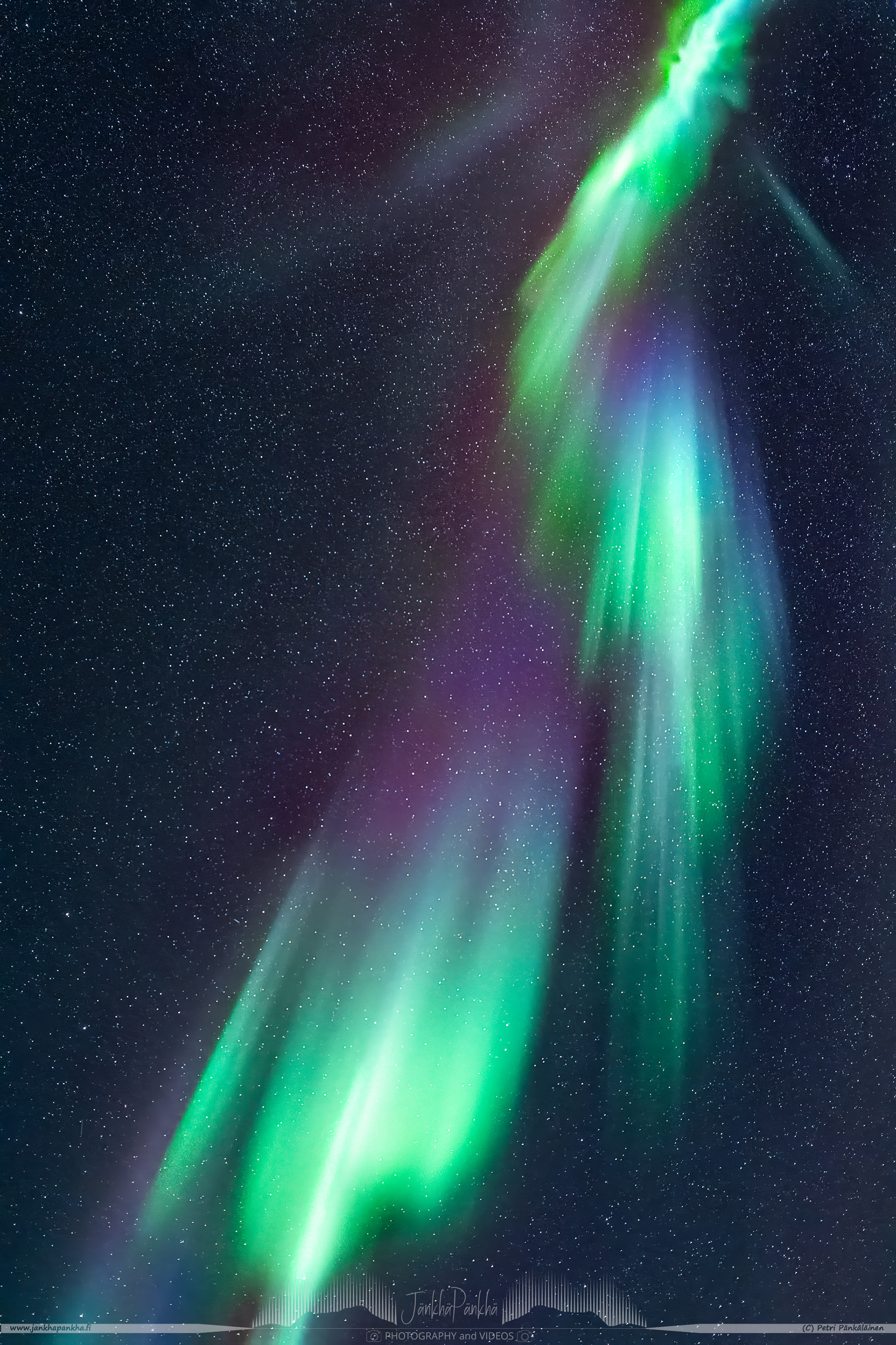 Northern lights overhead corona with purple, magenta and green colors, nearby the lake Ala-Kilpisjärvi, in Enontekiö, Finland.