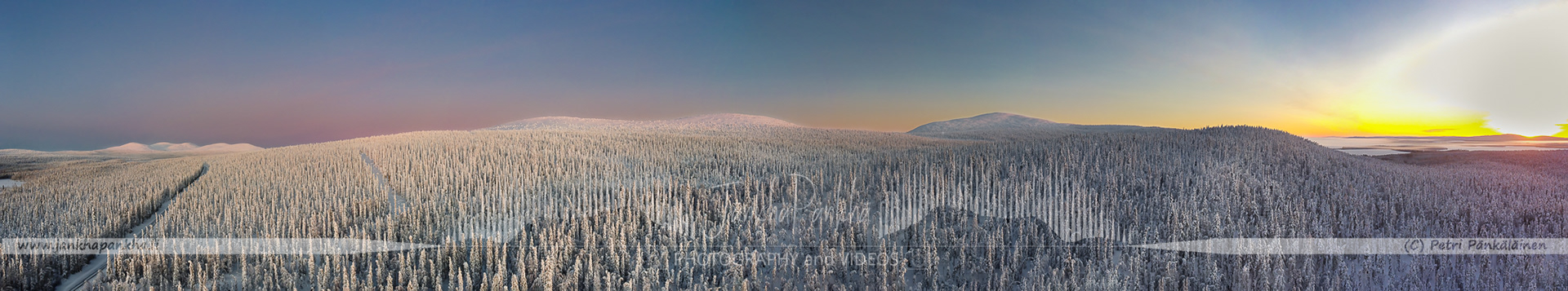 Pastel-colored skies and snow-covered landscapes during a polar night in Pallas-Yllästunturi National Park, Finland