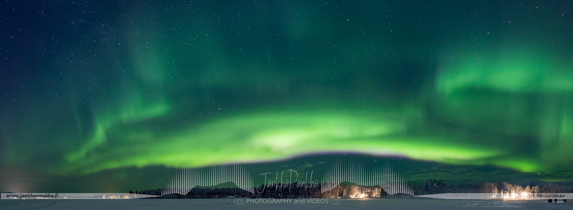 Panorama photo of the fastly moving northern lights over the lake Norvajärvi in Rovaniemi, Finland. Just beyond the artic circle. This is a very popular and touristic place in Rovaniemi. Make sure you go a bit further away not to be disturbed with flashlights and headlights.