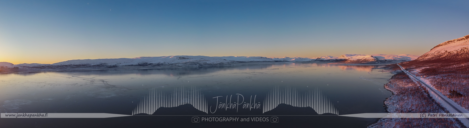 Beautiful pastel sunrise at Lake Kilpisjärvi, Enontekiö, with delicate colors mirrored on the frozen surface of the lake.