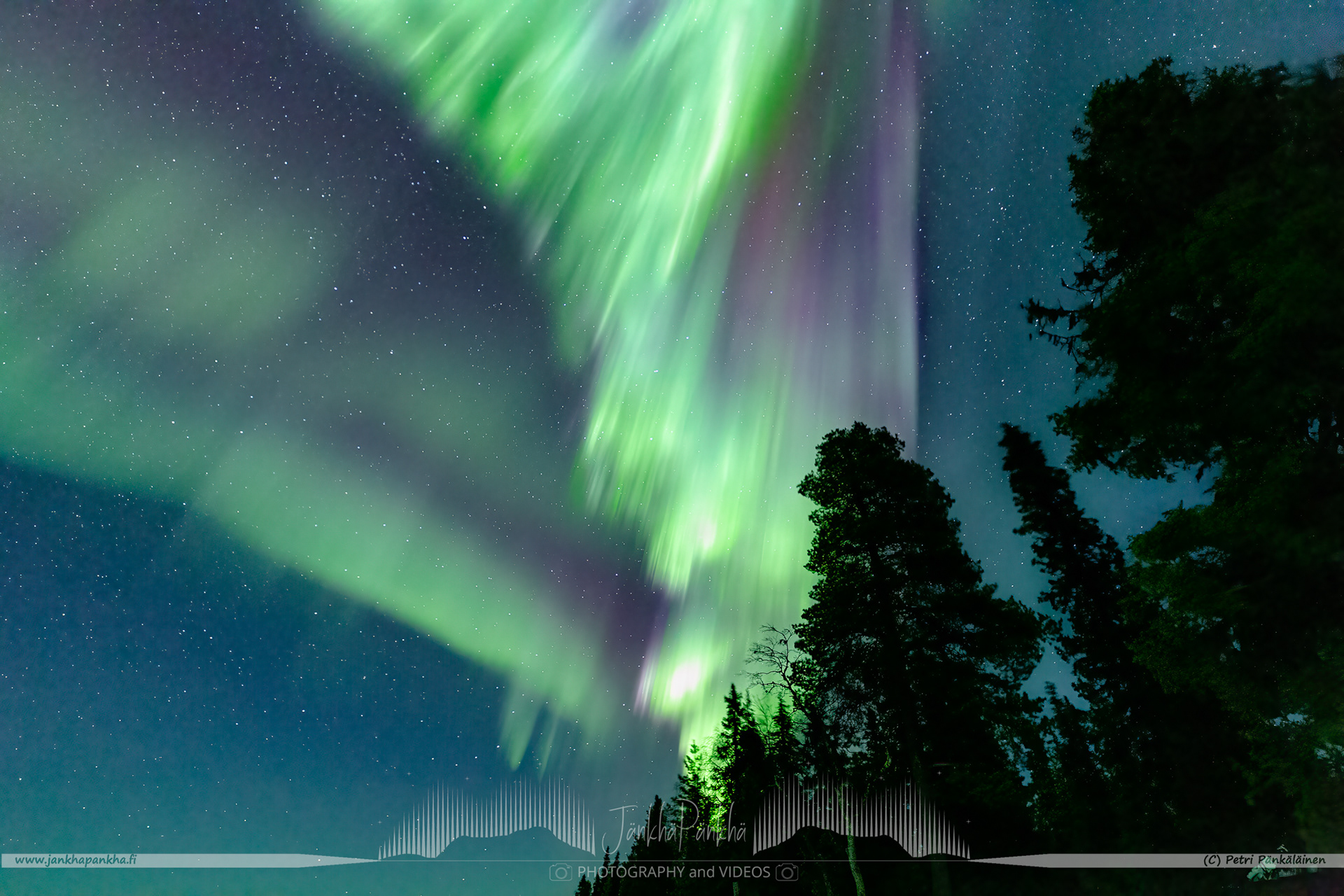 Full sky northern lights corona over the lake Pallasjärvi in Finland. The photo is from the Punainenhiekka hut. The  Punainenhiekka Day-use Hut is situated at the south end of Lake Pallasjärvi.