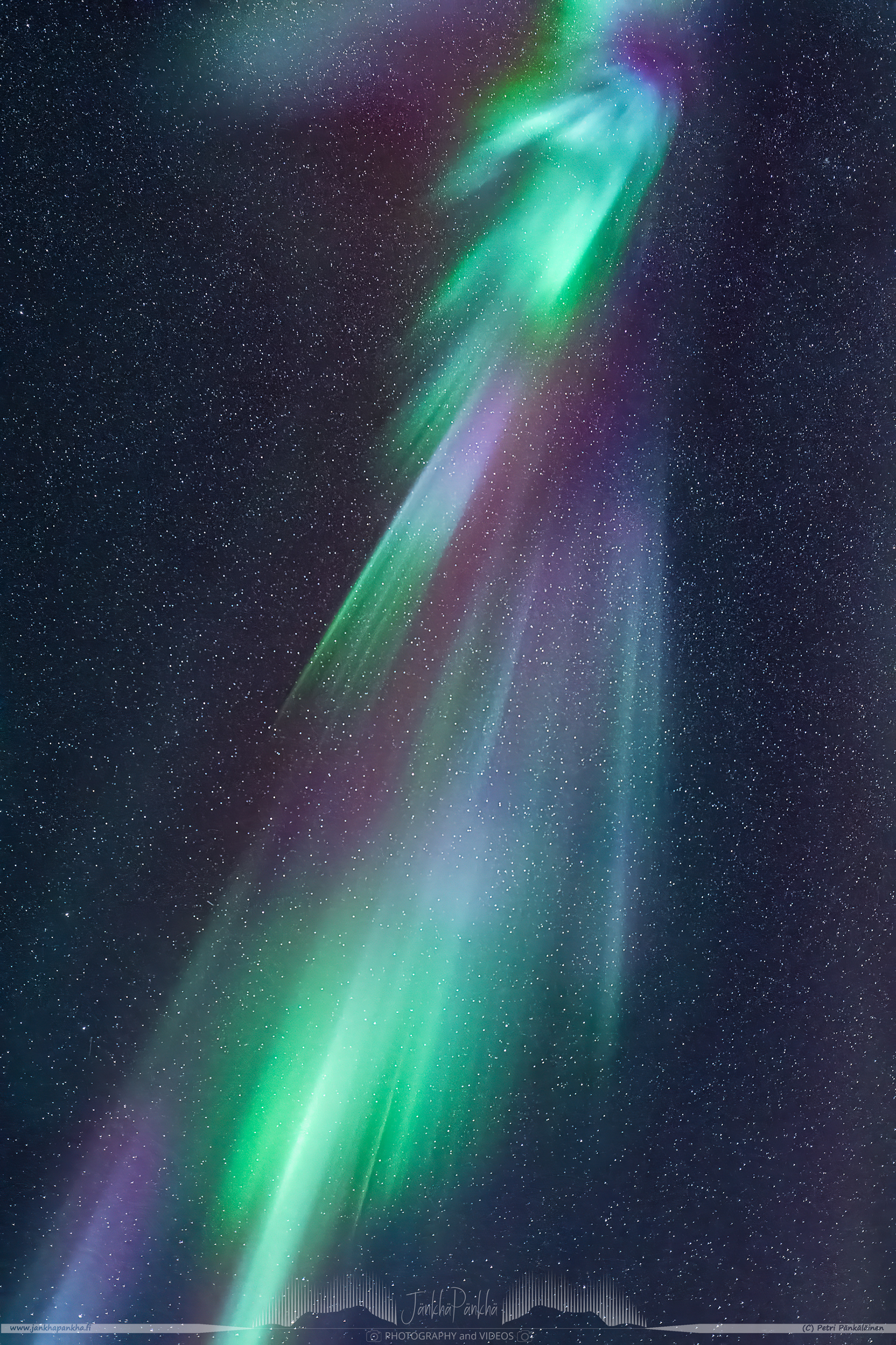 Northern lights overhead corona with purple, magenta and green colors, nearby the lake Ala-Kilpisjärvi, in Enontekiö, Finland.
