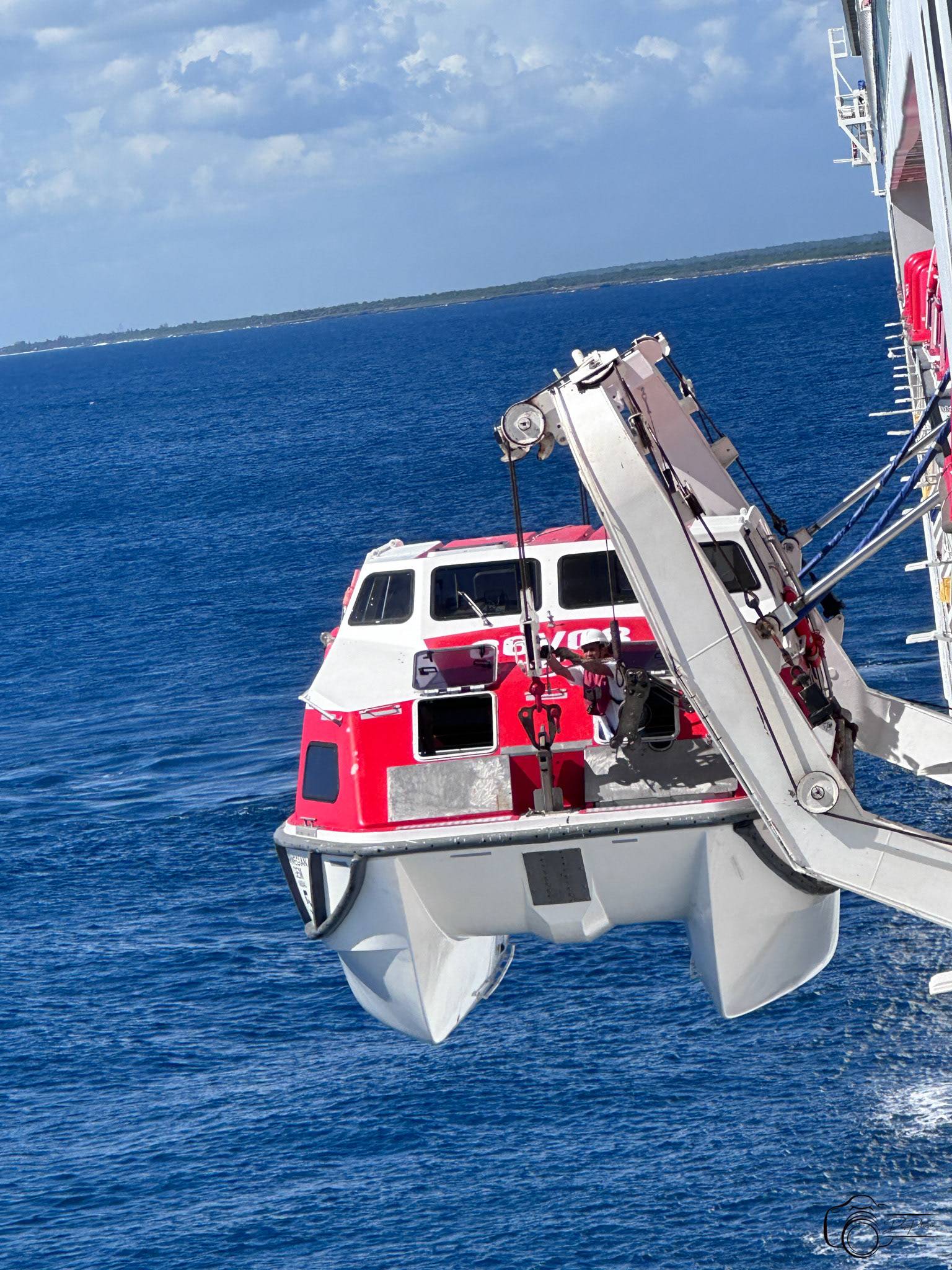 Lifeboat used as tender for Catalina Island, Dominican Republic being hoisted