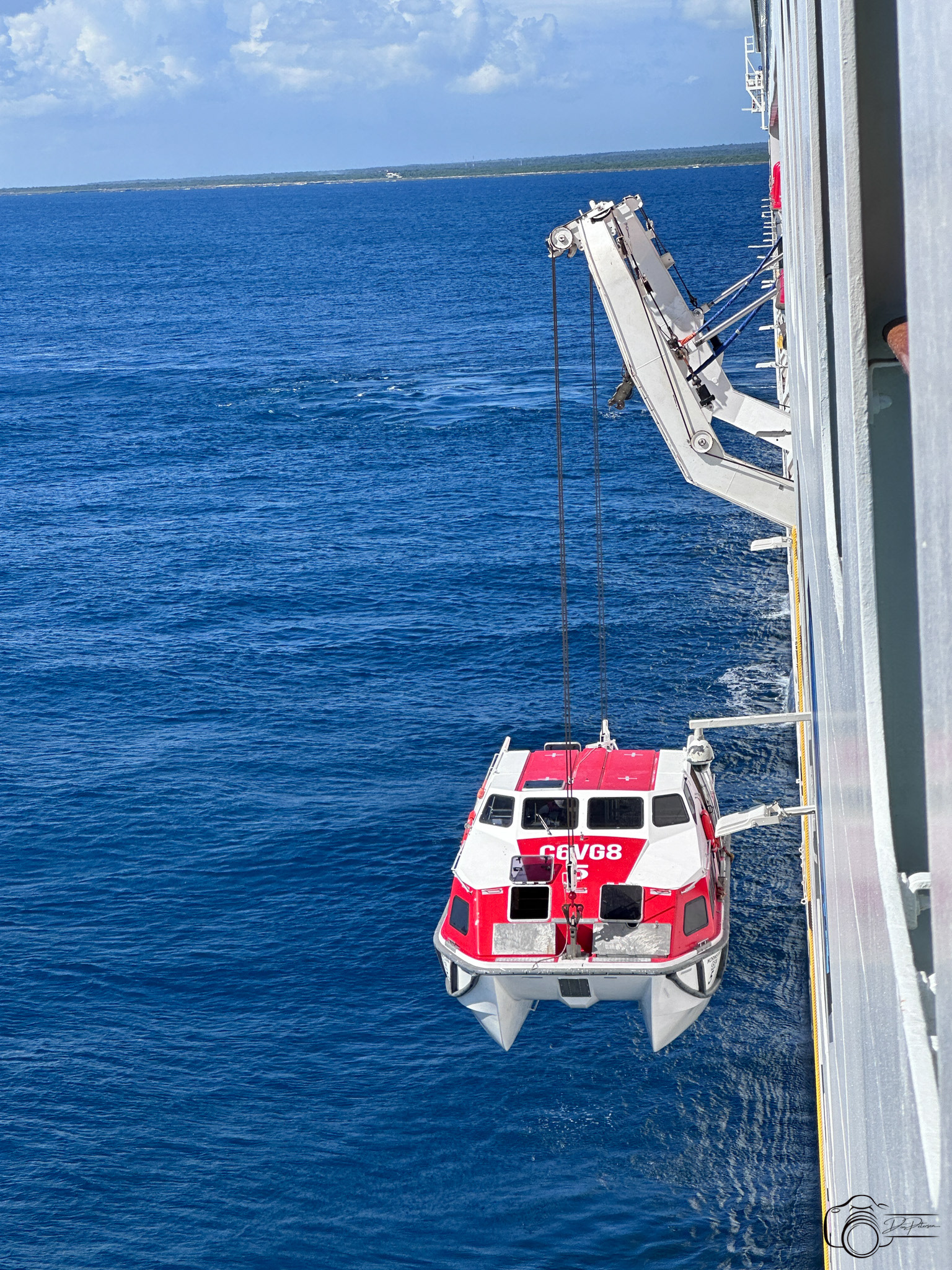 Lifeboat used as tender for Catalina Island, Dominican Republic being hoisted