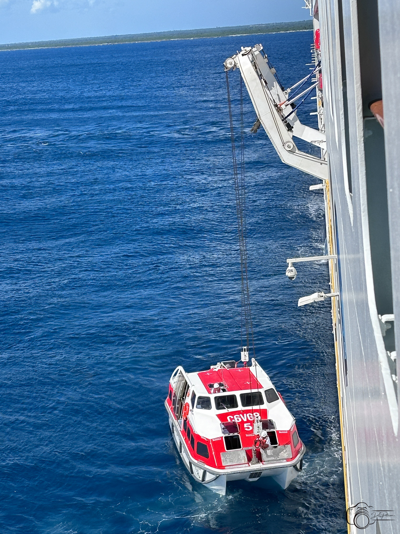 Lifeboat used as tender for Catalina Island, Dominican Republic being hoisted