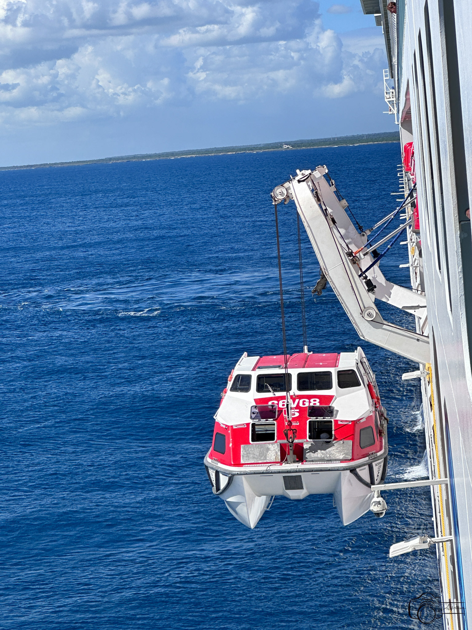 Lifeboat used as tender for Catalina Island, Dominican Republic being hoisted