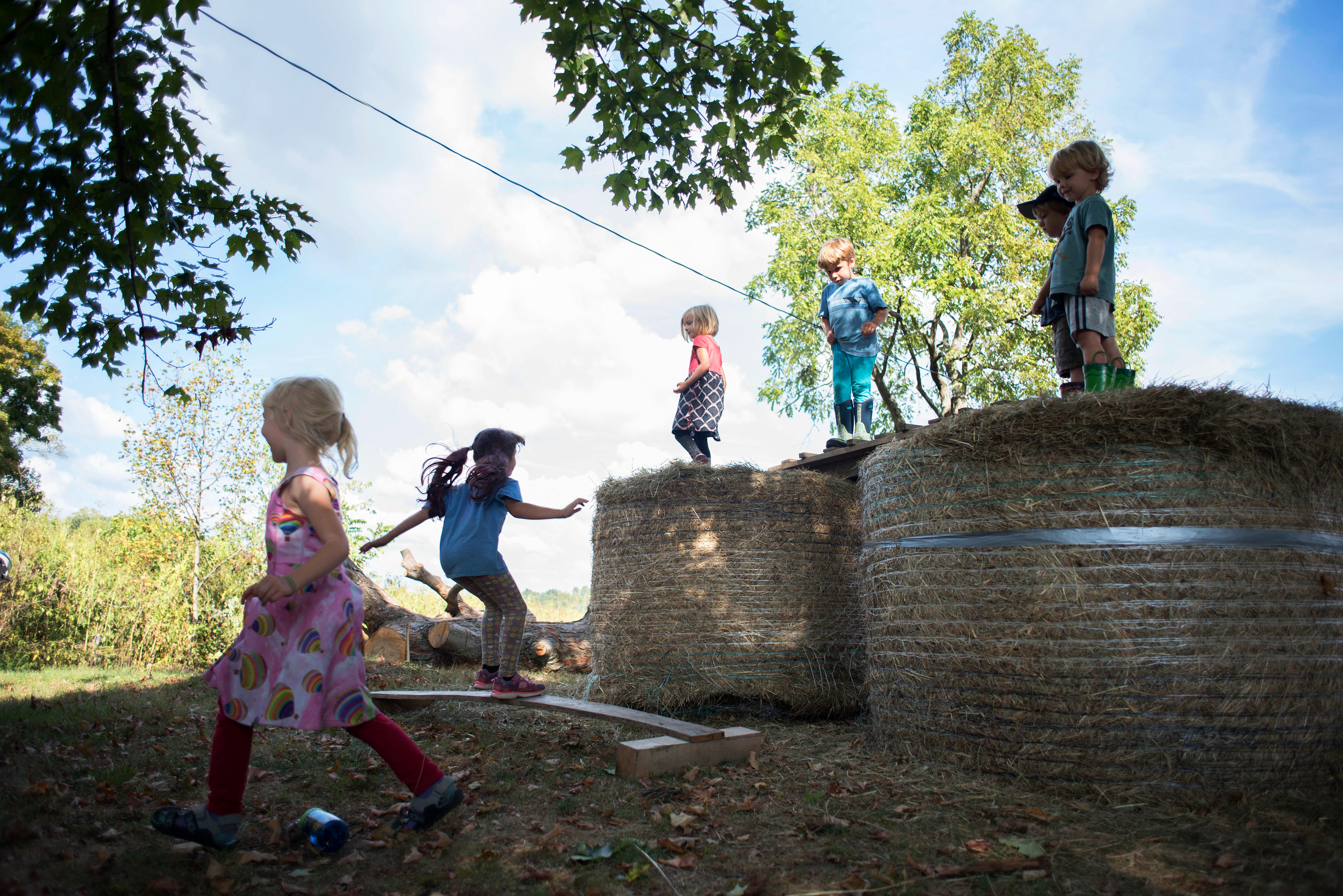 Kids run around on the natural playground after school at Solid Ground Farm/School in Athens, Ohio. September 16, 2019.