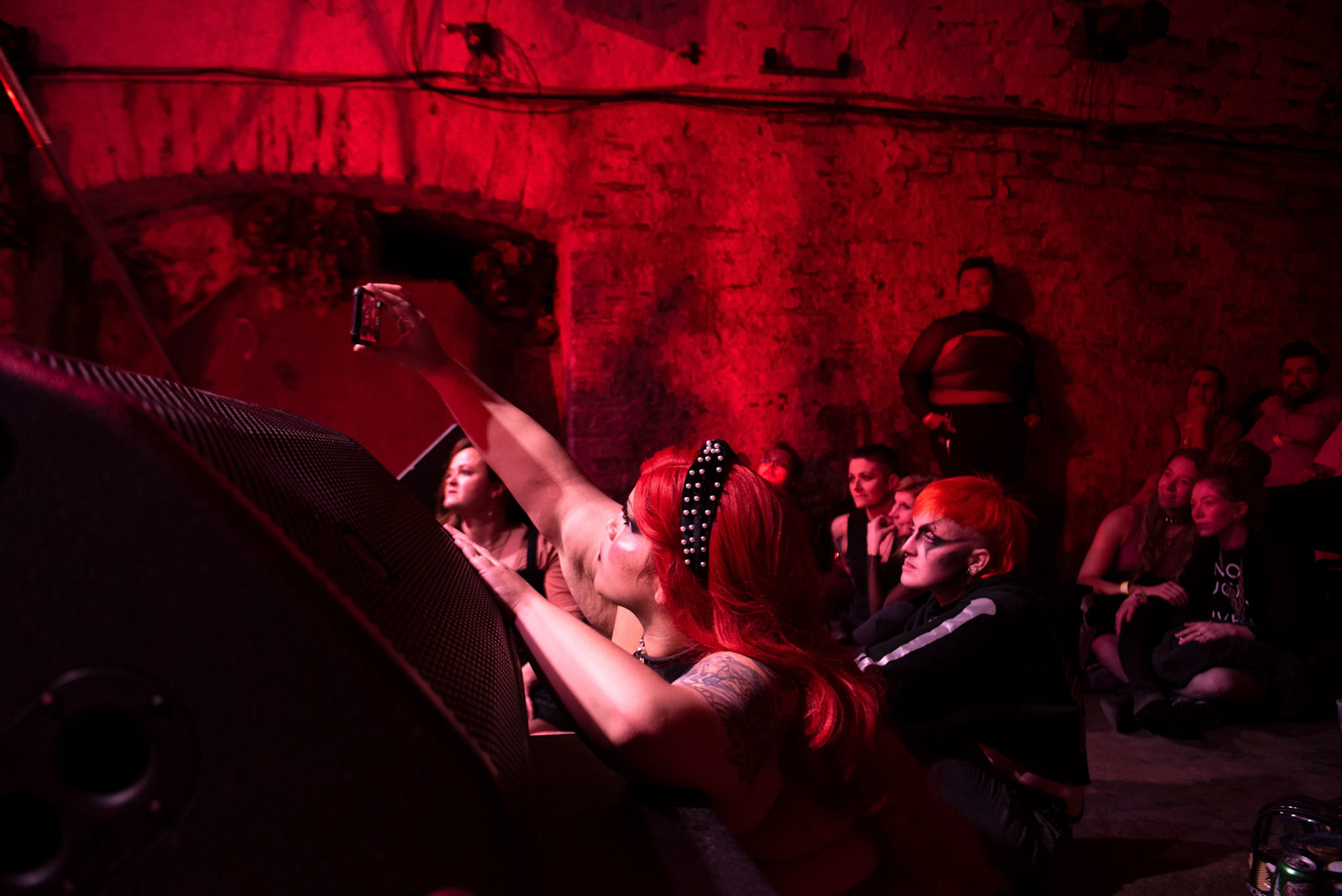 The audience watch as a couple performs aerial bondage during the Fetish Ball hosted by the Mockbee in Cincinnati, Ohio. This event took place November 19, 2022. 