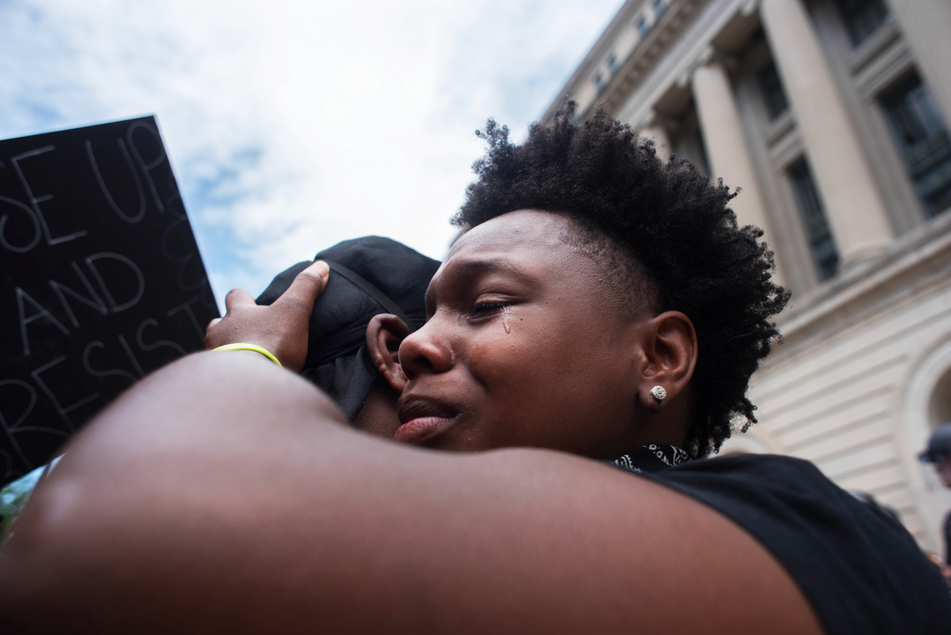 Darian Burgin embraces a friend after giving a touching speech at a BLM protest in Downtown Cincinnati, Ohio on June 1, 2020. The protest was in response to the murder of George Floyd.