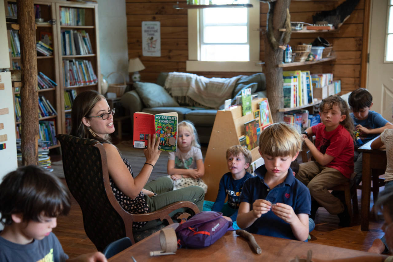 Teacher Christin Butler reads "My Fathers Dragon" to the kids inside the classroom on Friday, September 27, 2019. Solid Ground School enrolls kids aged 4-8 and have a student to teacher ratio of 9:1.