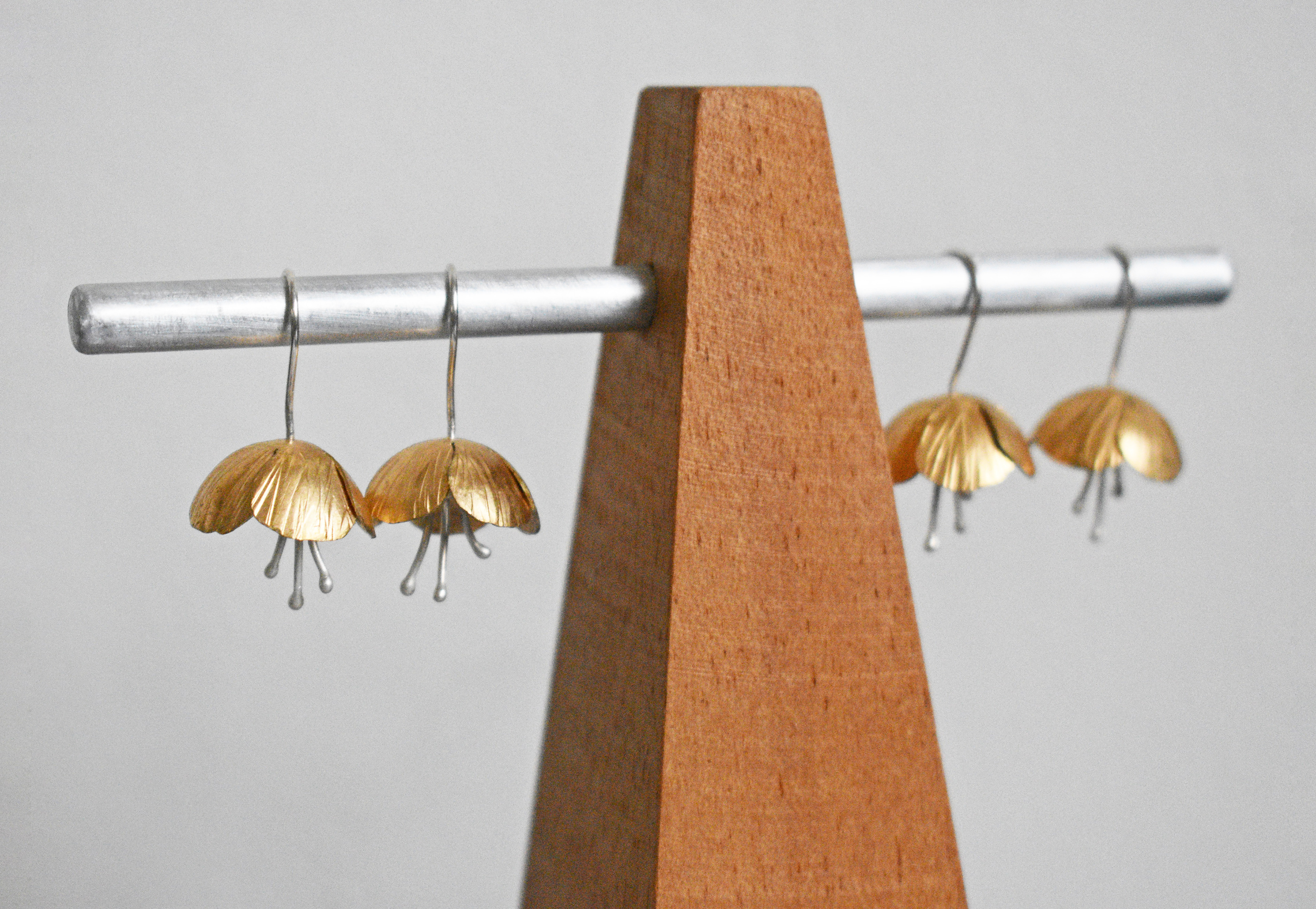brass and silver flower threader earrings