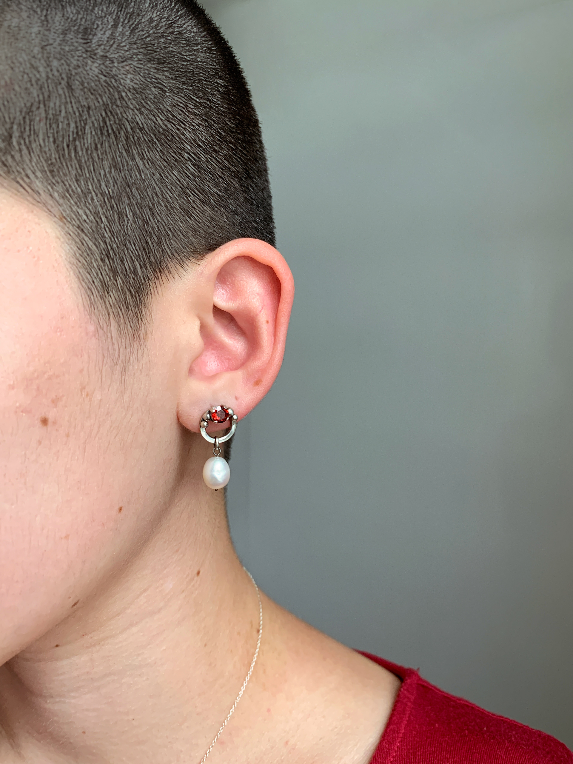 prong-set garnet earrings with pearl drops