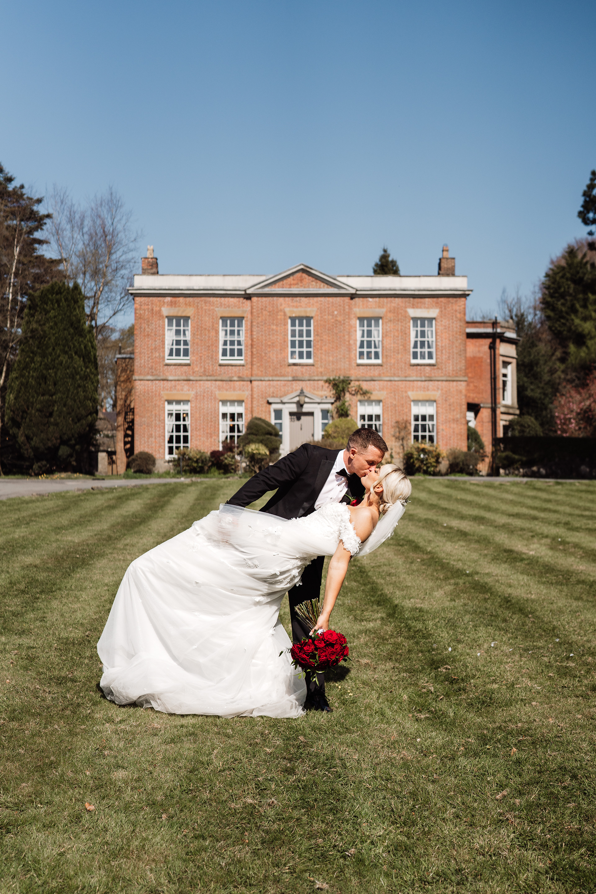 Modern black tie couple portraits at Rivington Hall Barn wedding venue in Lancashire - emotional wedding storytelling through photos and videos