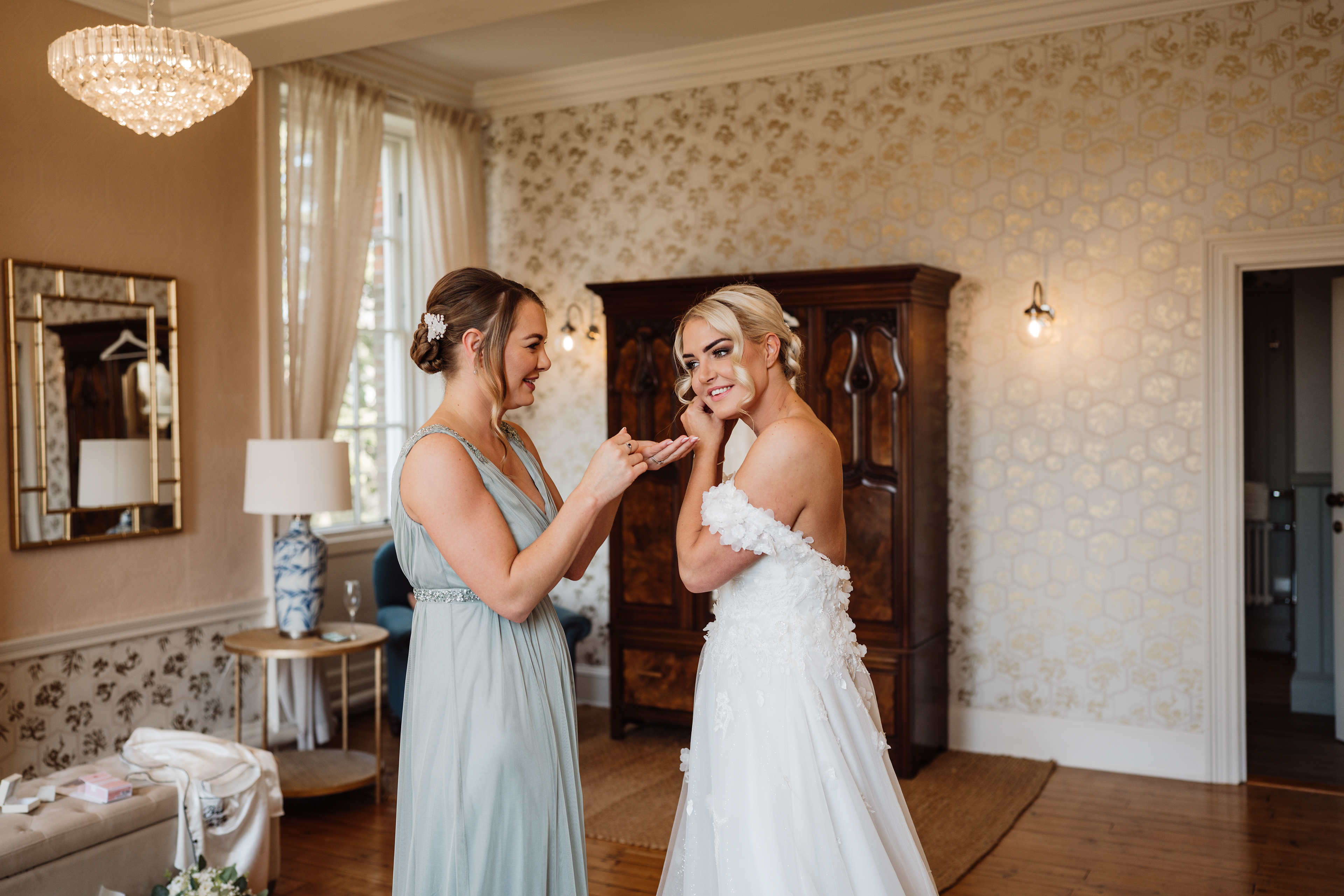 Bride getting ready - candid and emotional wedding photography and videography at Rivington Hall Barn