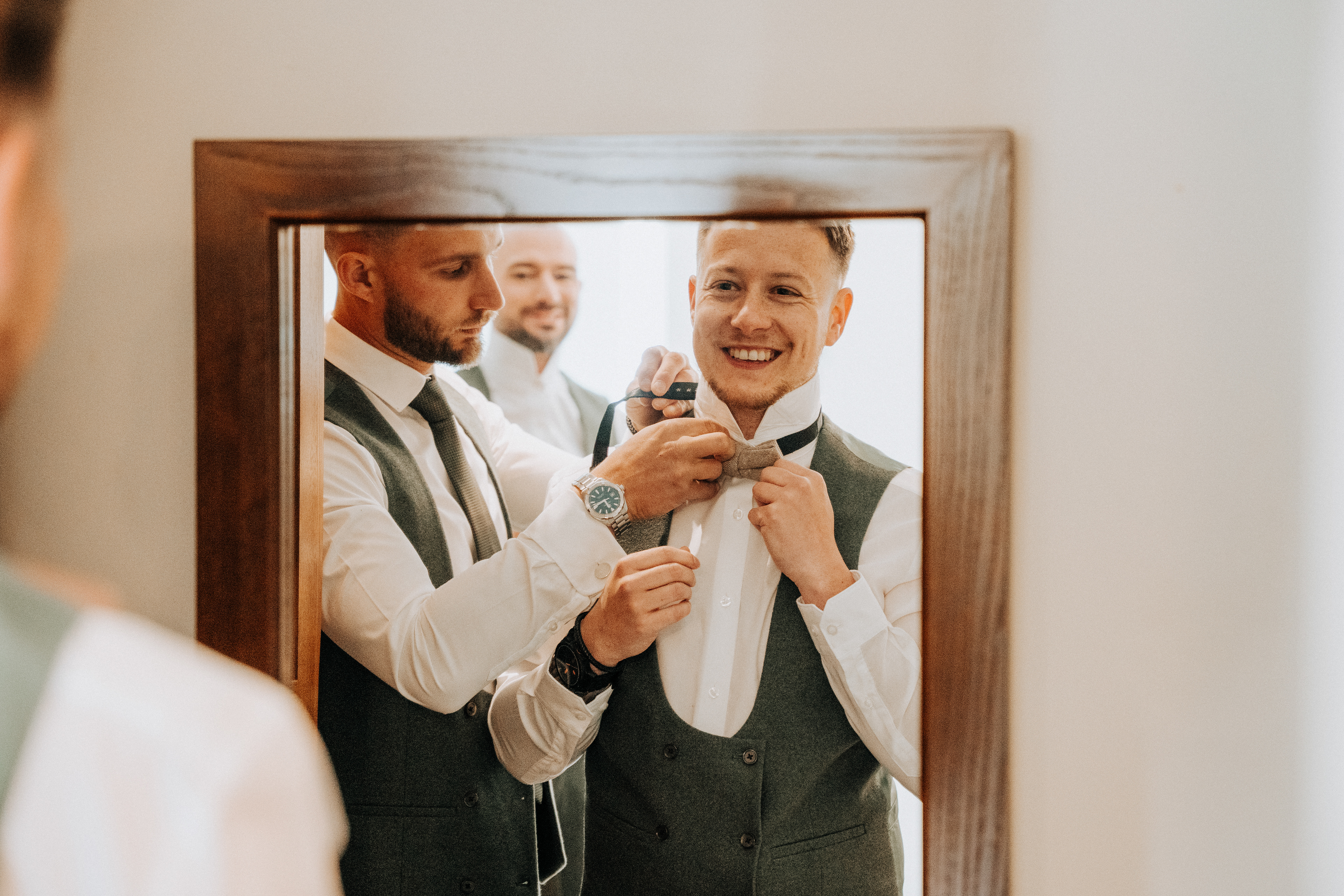 Groom preparations photography husband and wife team