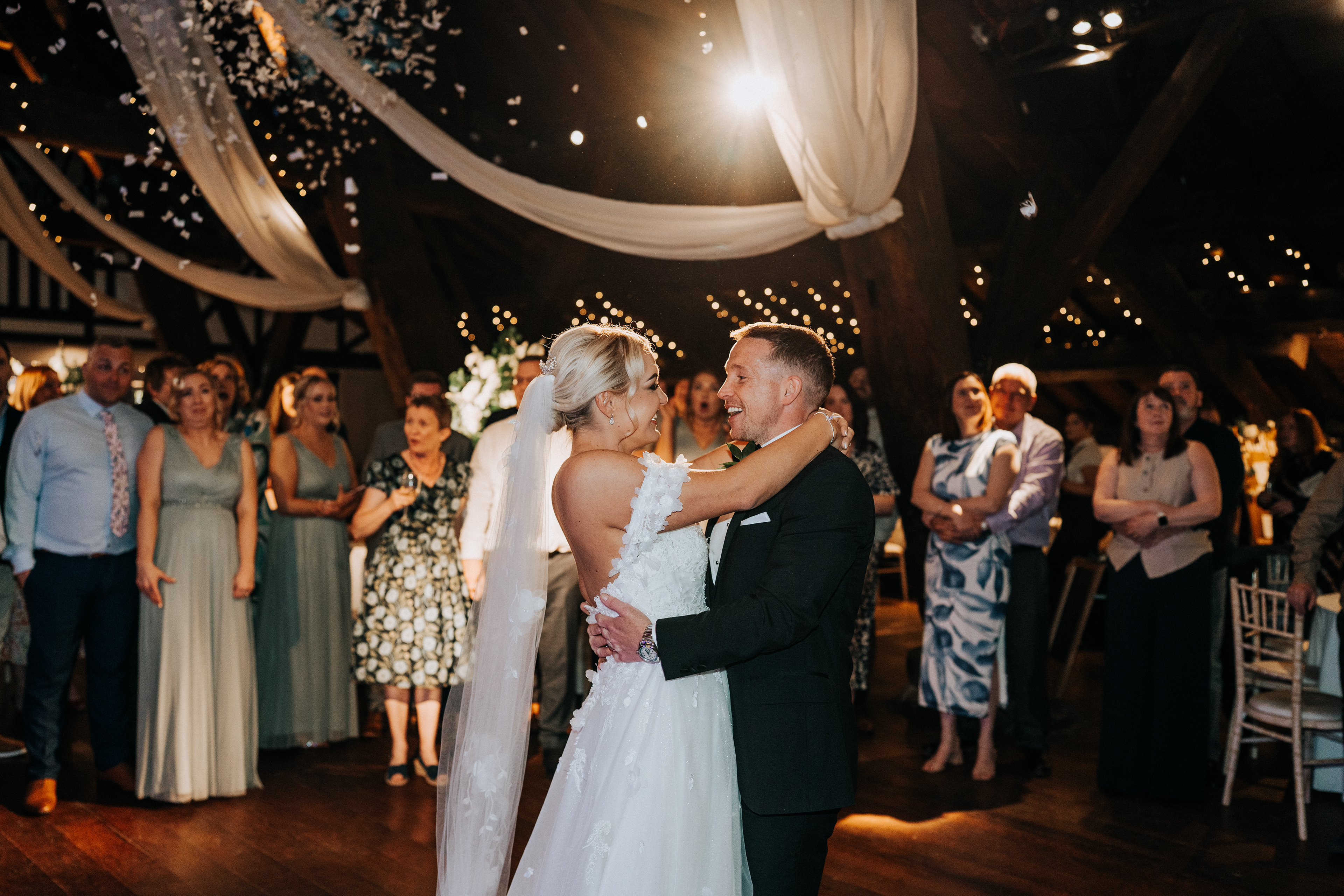 Epic first dance with confetti cannons at Rivington Hall Barn in Lancashire - natural wedding photography and videography team