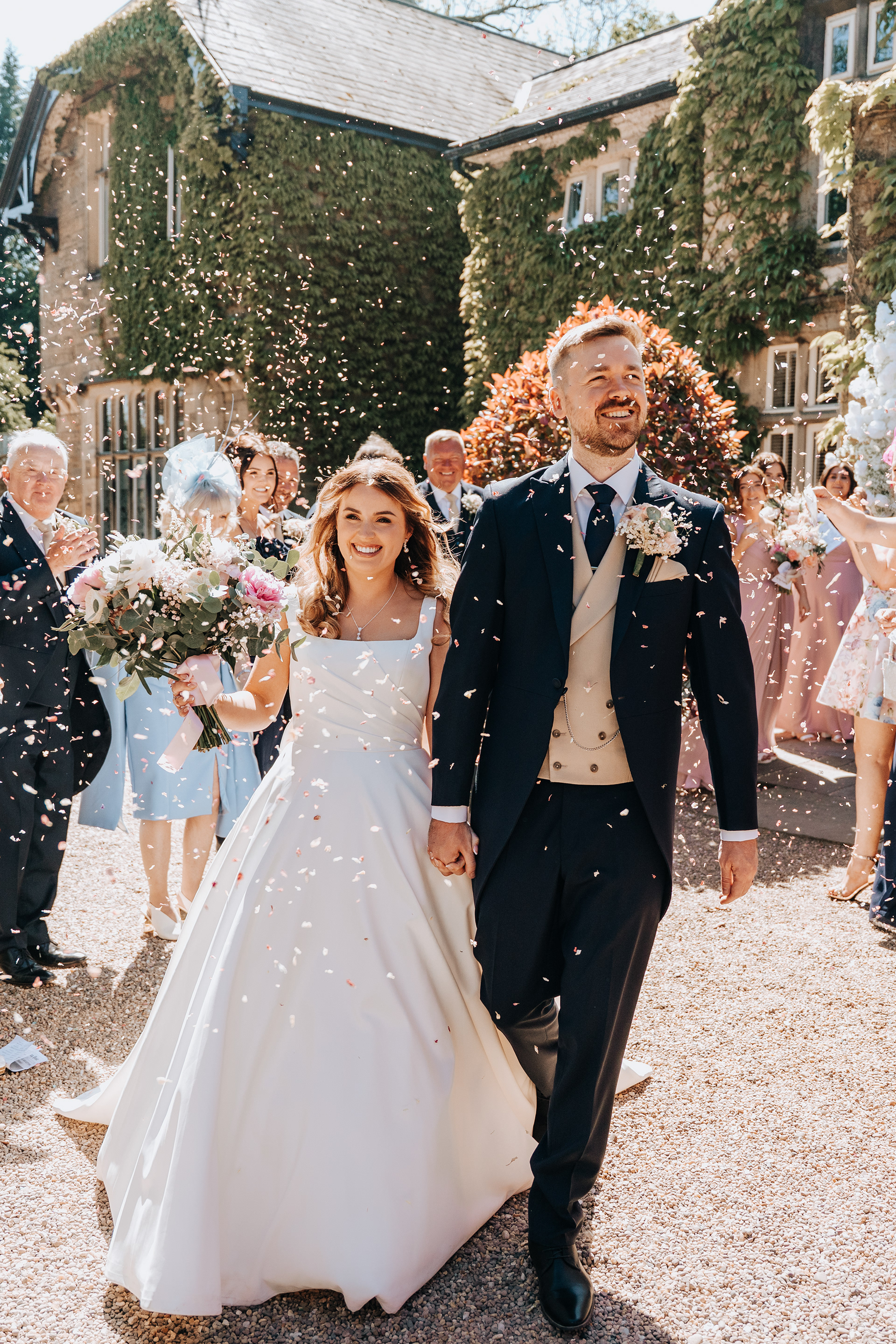 Candid confetti moments from husband and wife photography and videography team in Lancashire, North West