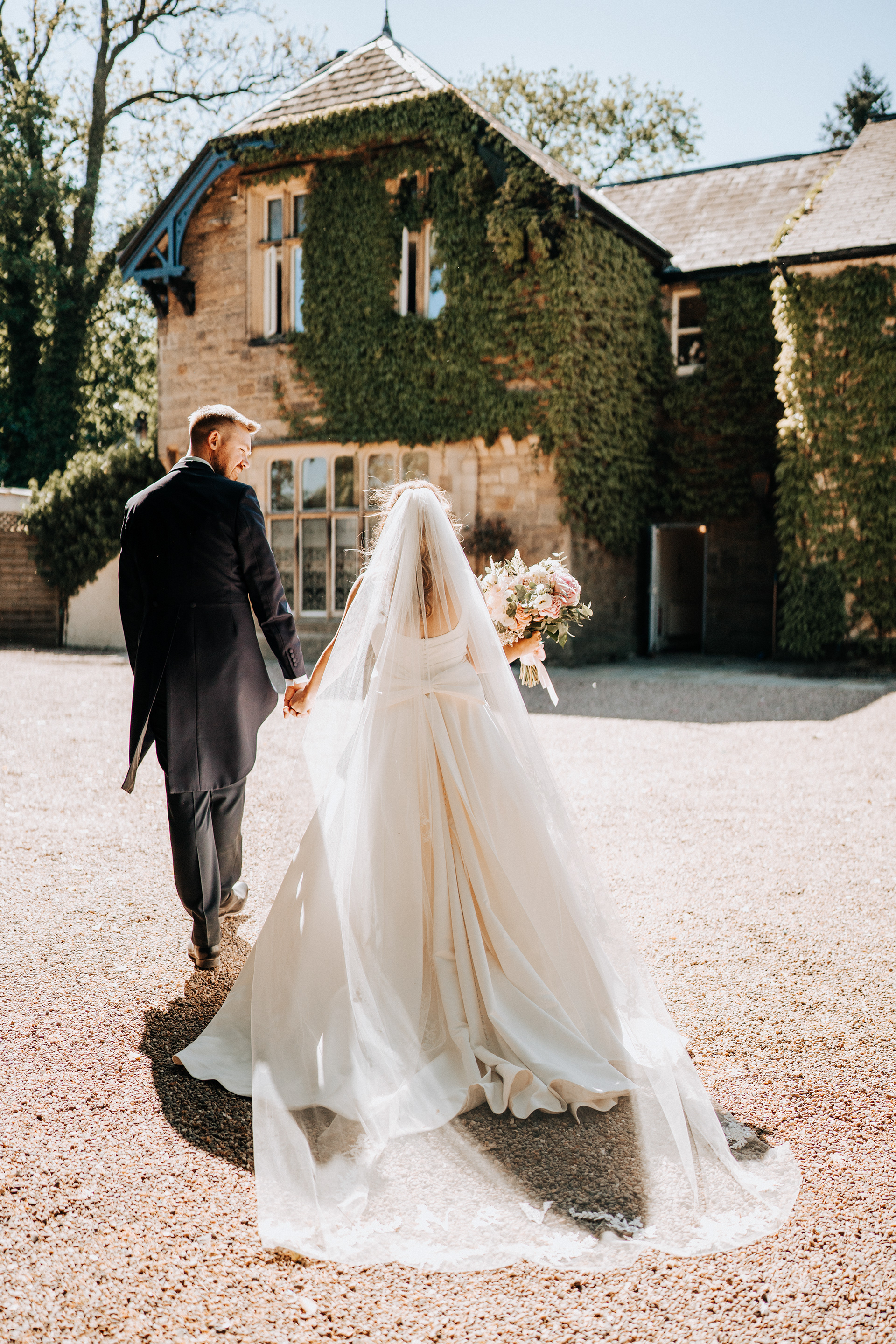 Bride and groom portraits and couple portraits with a relaxed approach at Mitton Hall in Lancashire