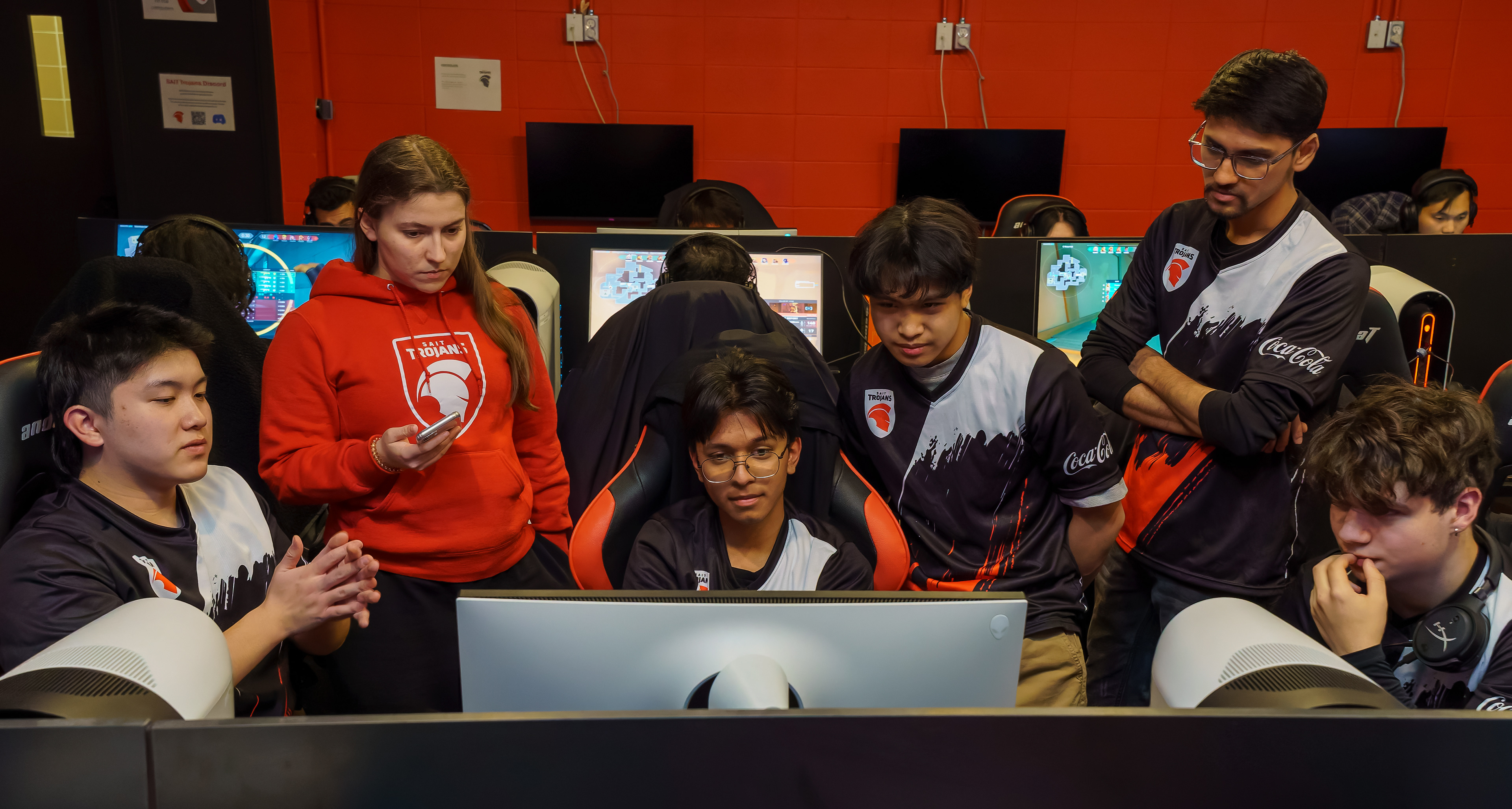 The SAIT Trojans Esports Valorant Team review game footage after a close 1-2 loss in the Esports Studio in Senator Burns Building at SAIT in Calgary on Wednesday, Feb. 12, 2025.