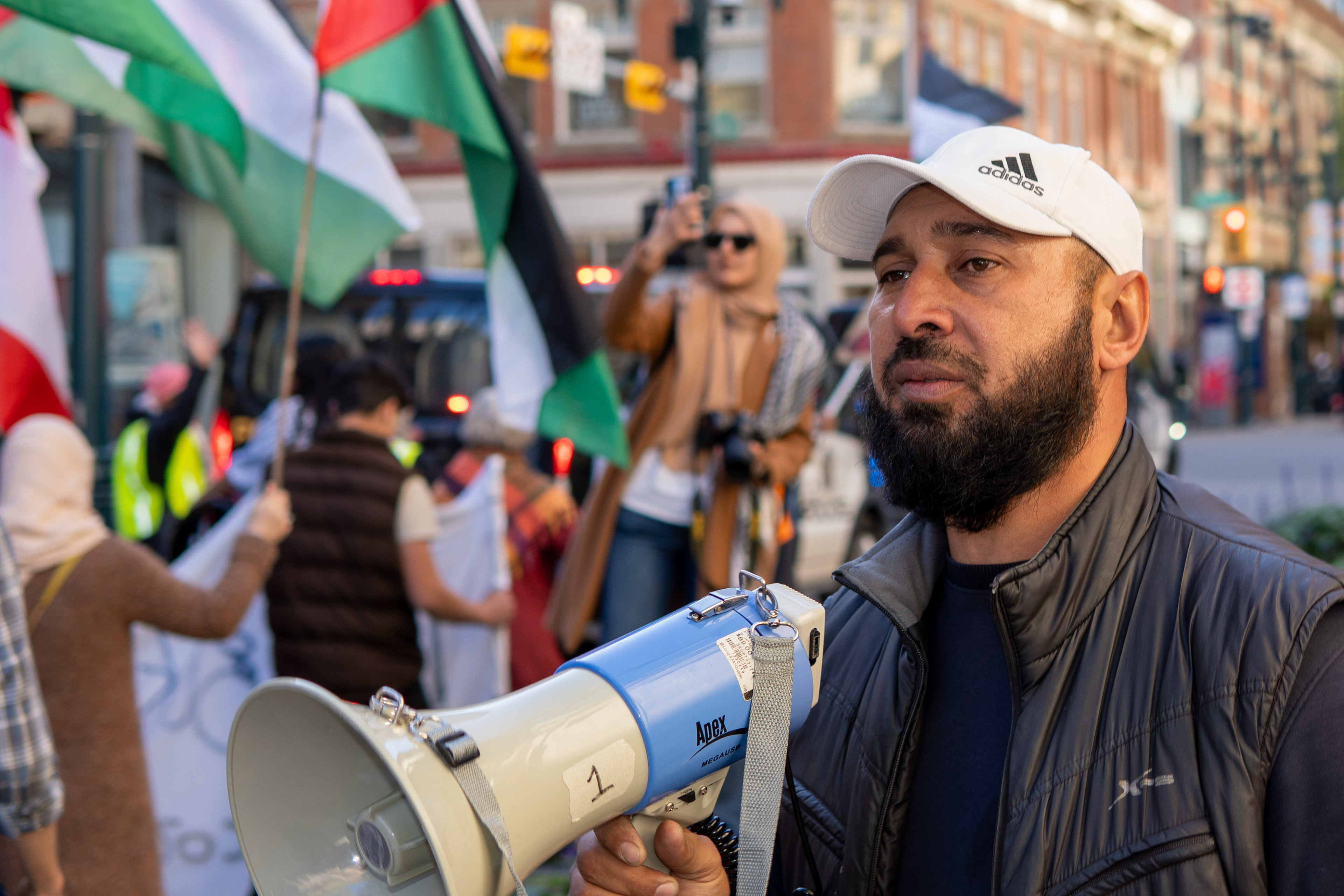A protest leader pauses his chant and looks onto the crowd of the Justice for Palestinians protest on Stephen Avenue in Calgary on Saturday, Oct. 5, 2024.