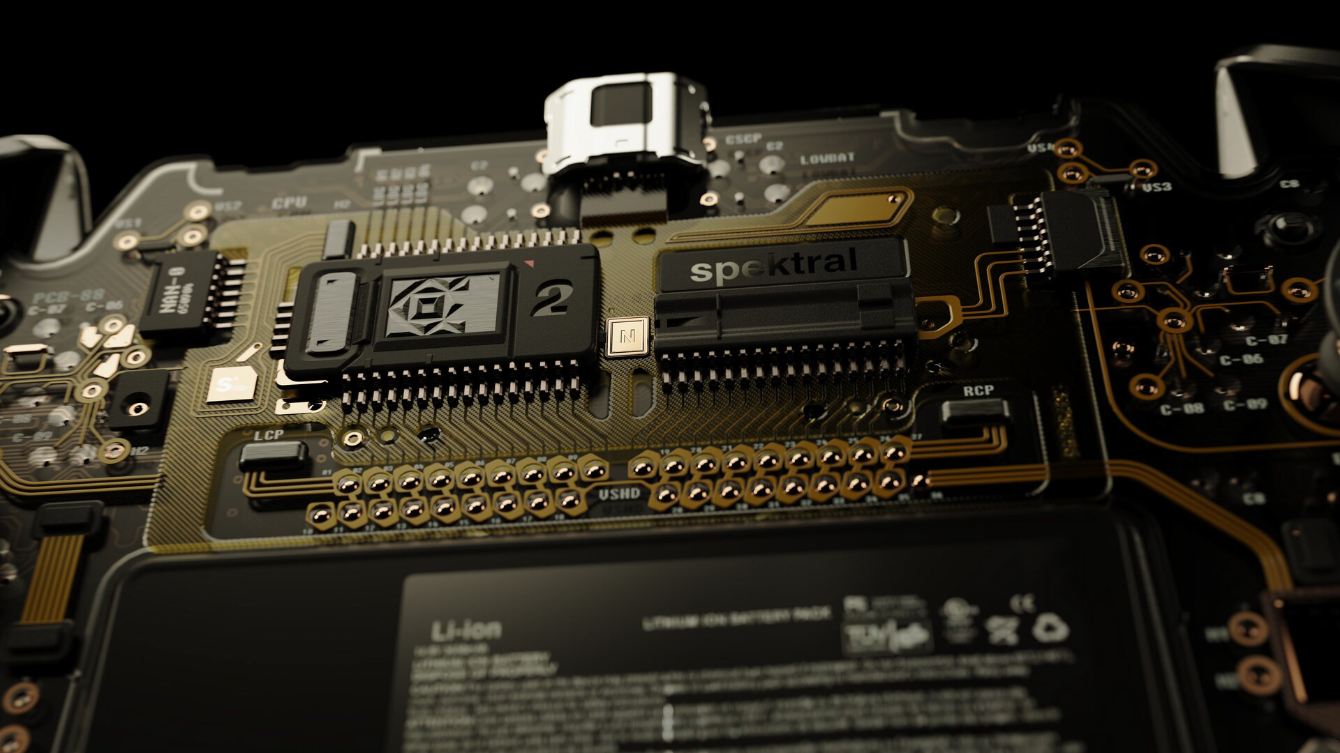 Close-up of a handheld console's circuit board, featuring "Spektral" branding and various electronic components.