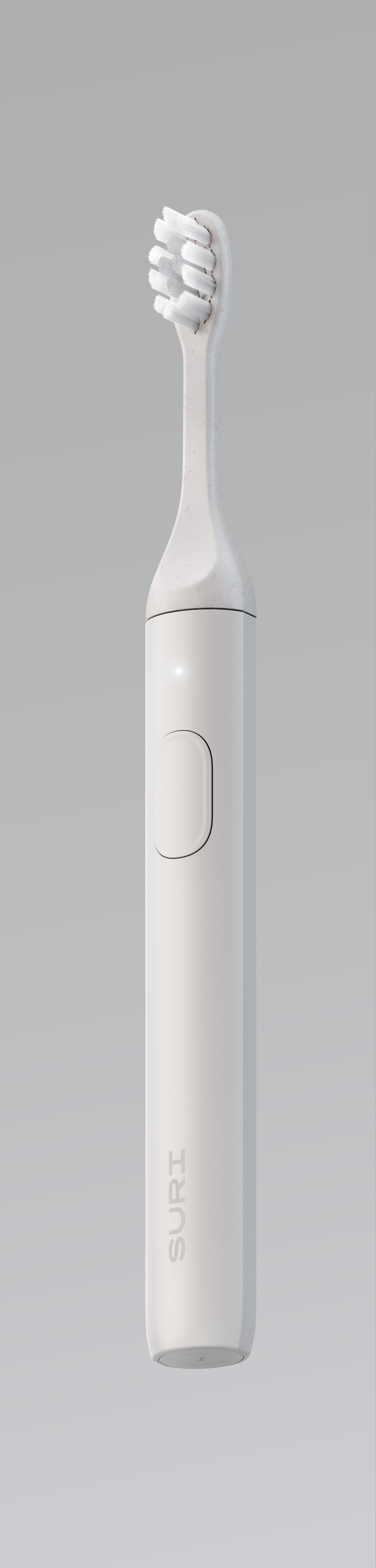 A white electric toothbrush with a minimalist design, featuring a simple button on the side and the brand name "SURI" on the handle.