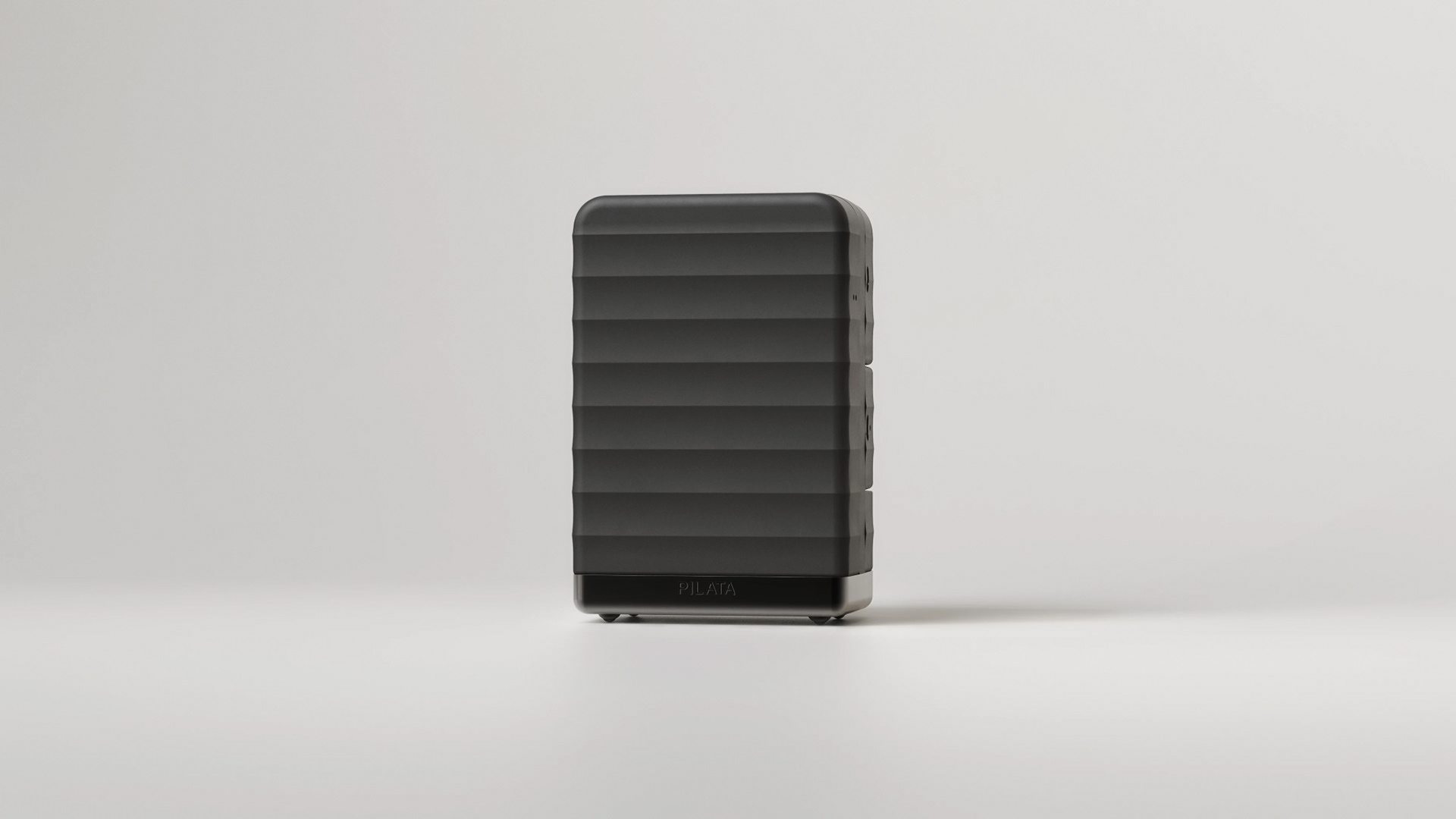 A sleek, rectangular power bank with a textured surface and a small logo on the side.