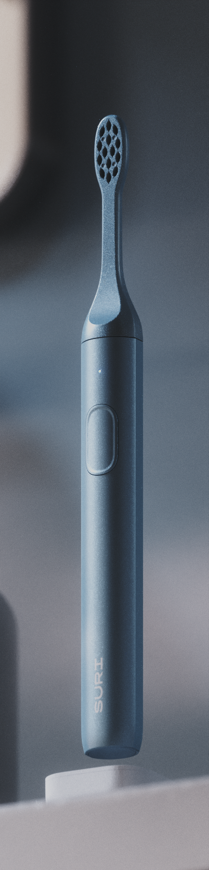 A sleek, dark blue electric toothbrush with a textured head and a button on the handle, labeled SURI.