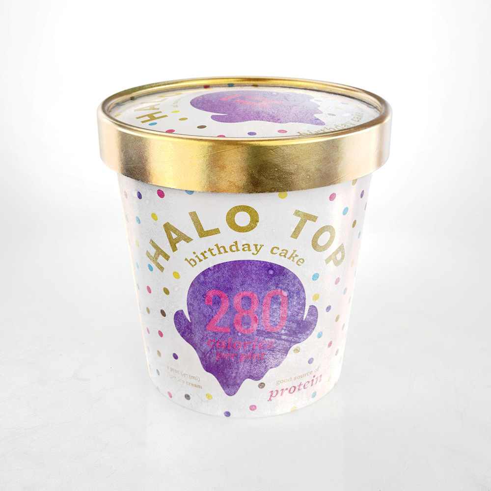 A Halo Top ice cream pint in a gold lid container, featuring a colorful label with "Halo Top" and "birthday cake" written on it, along with nutritional information.