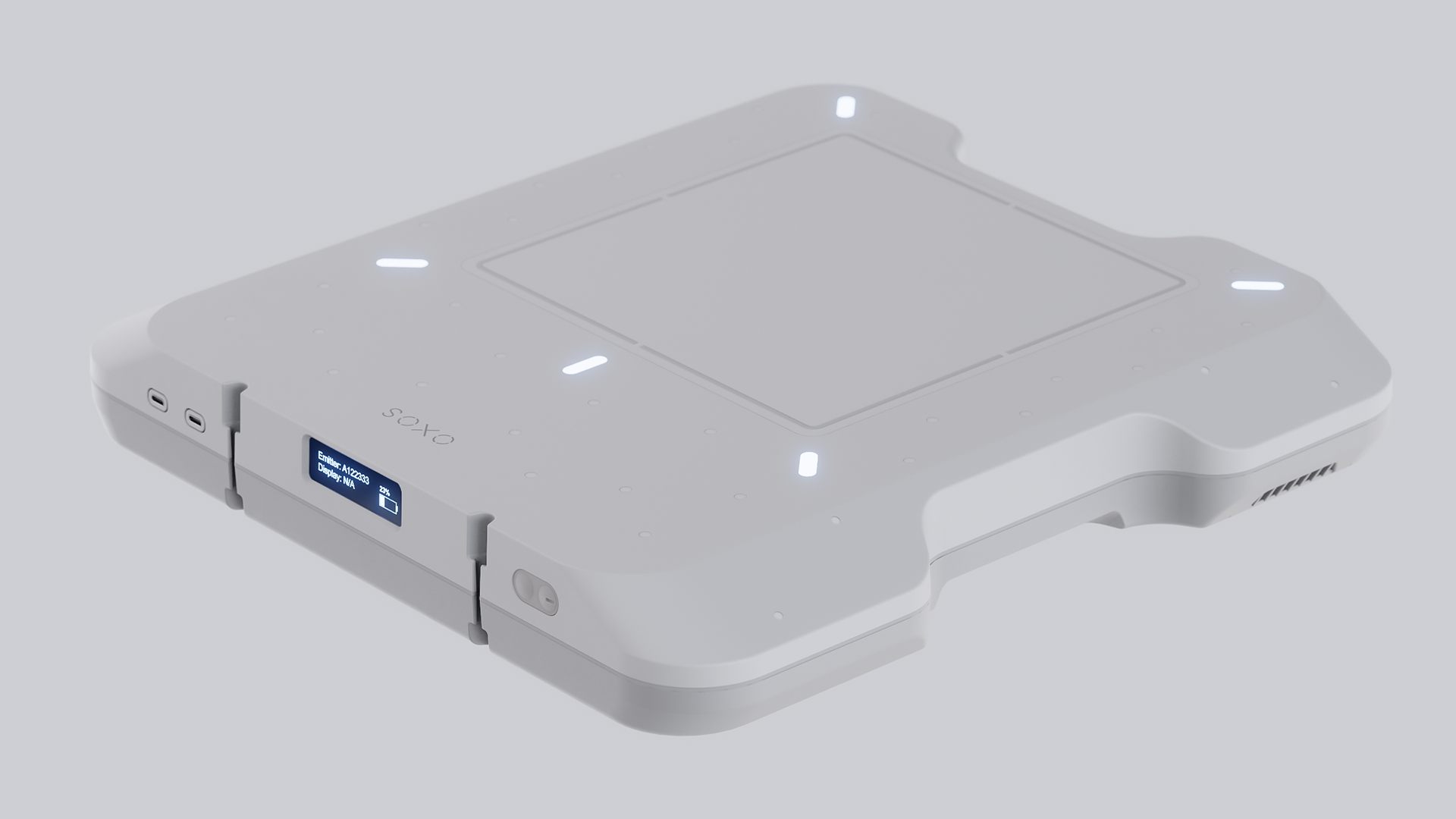 A sleek, white portable precision device with a rectangular screen and buttons, featuring a USB port and a label reading OXOS.