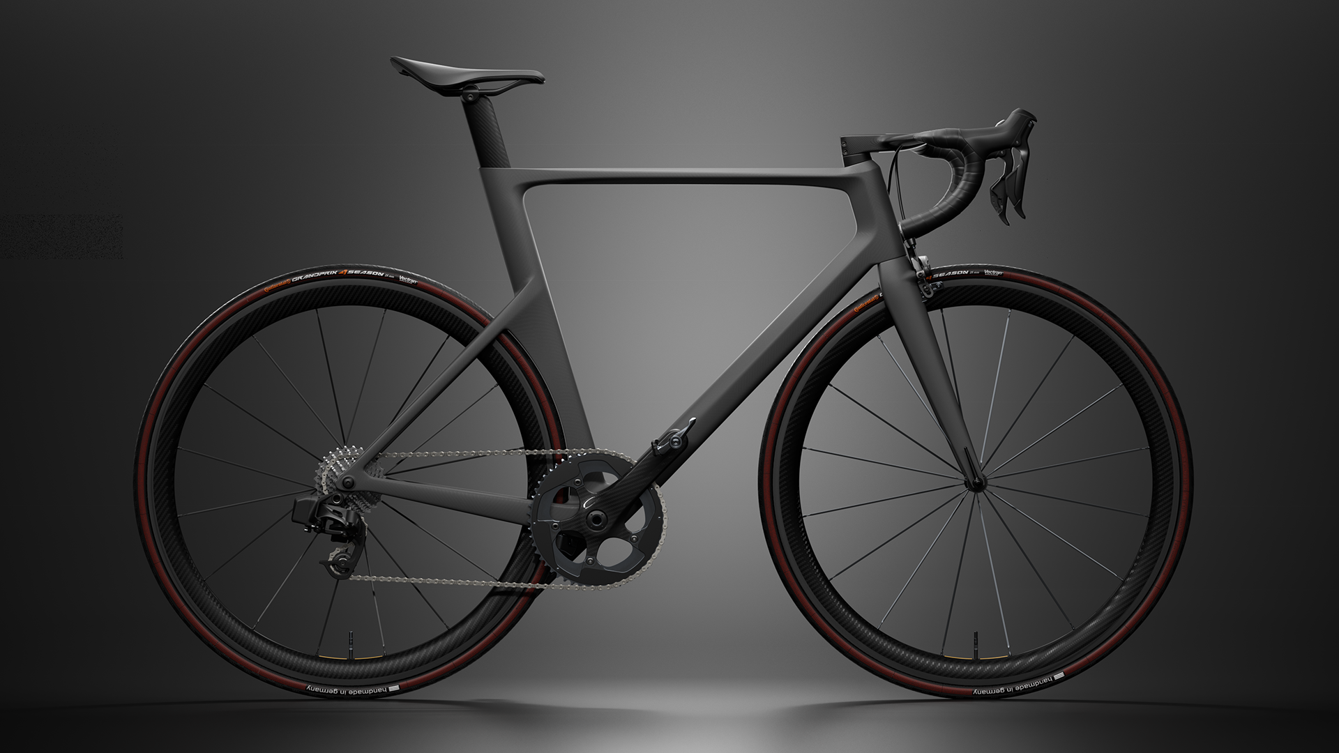 A carbon fiber bicycle frame with a matte finish, featuring a drop handlebar, integrated seat post, and a chainset with a gear system.