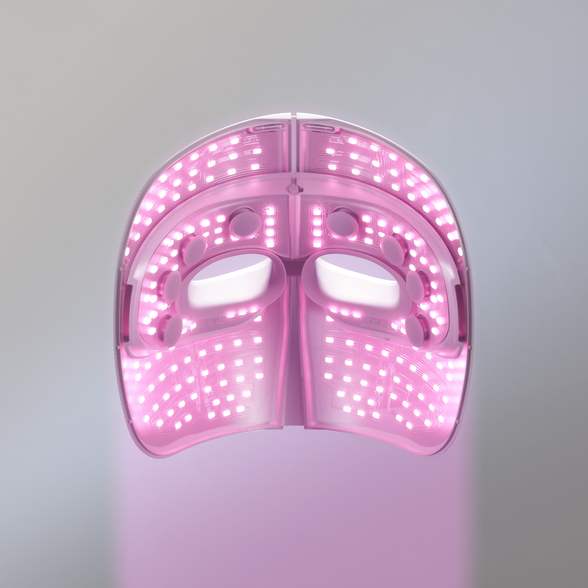 A pink LED mask with illuminated dots on a white background.