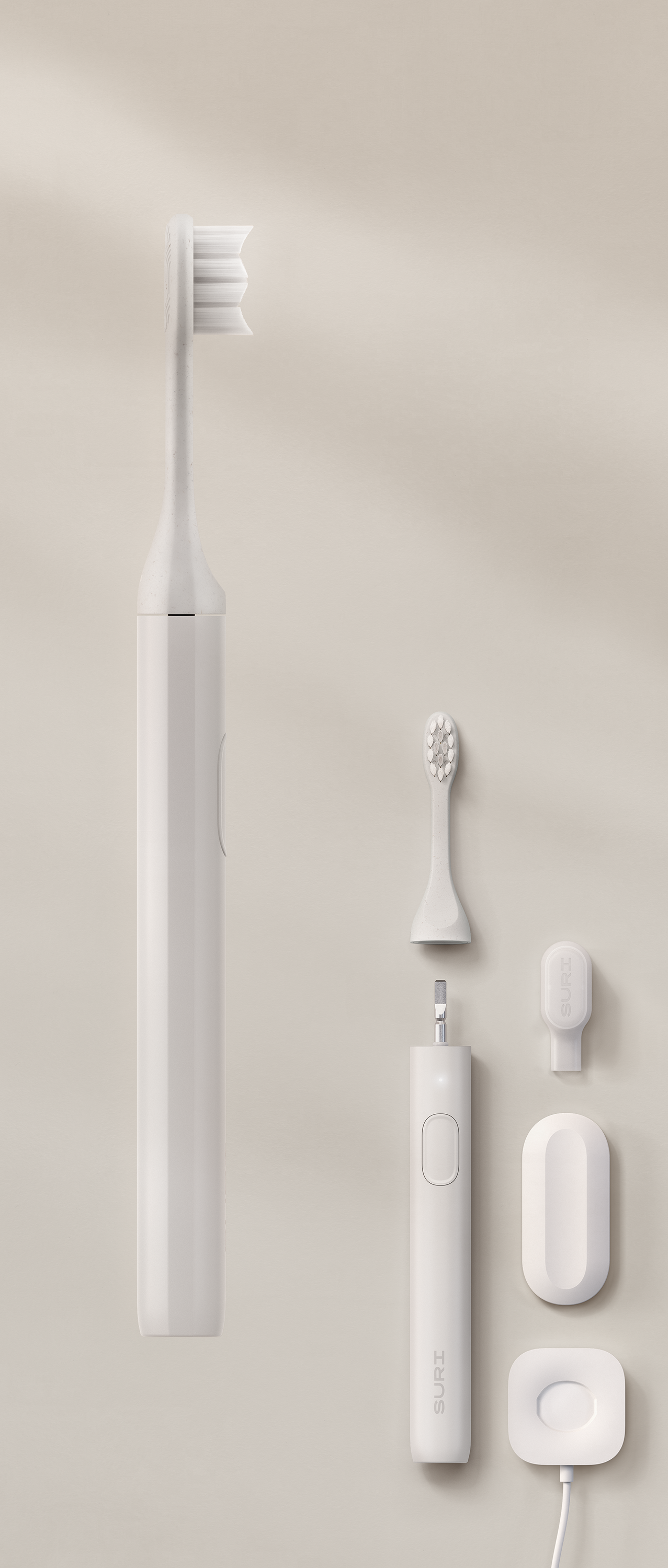 White SURI electric toothbrush, brush head, charging case, and small accessories arranged vertically on a pale background.