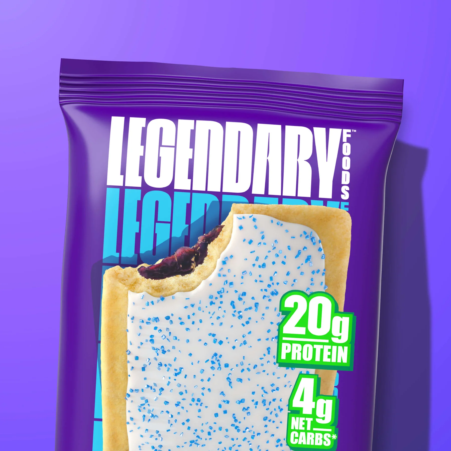 A bag of "Legendary Foods" protein bars with a blueberry flavor, showing "20g PROTEIN" and "4g NET CARBS" on the packaging.