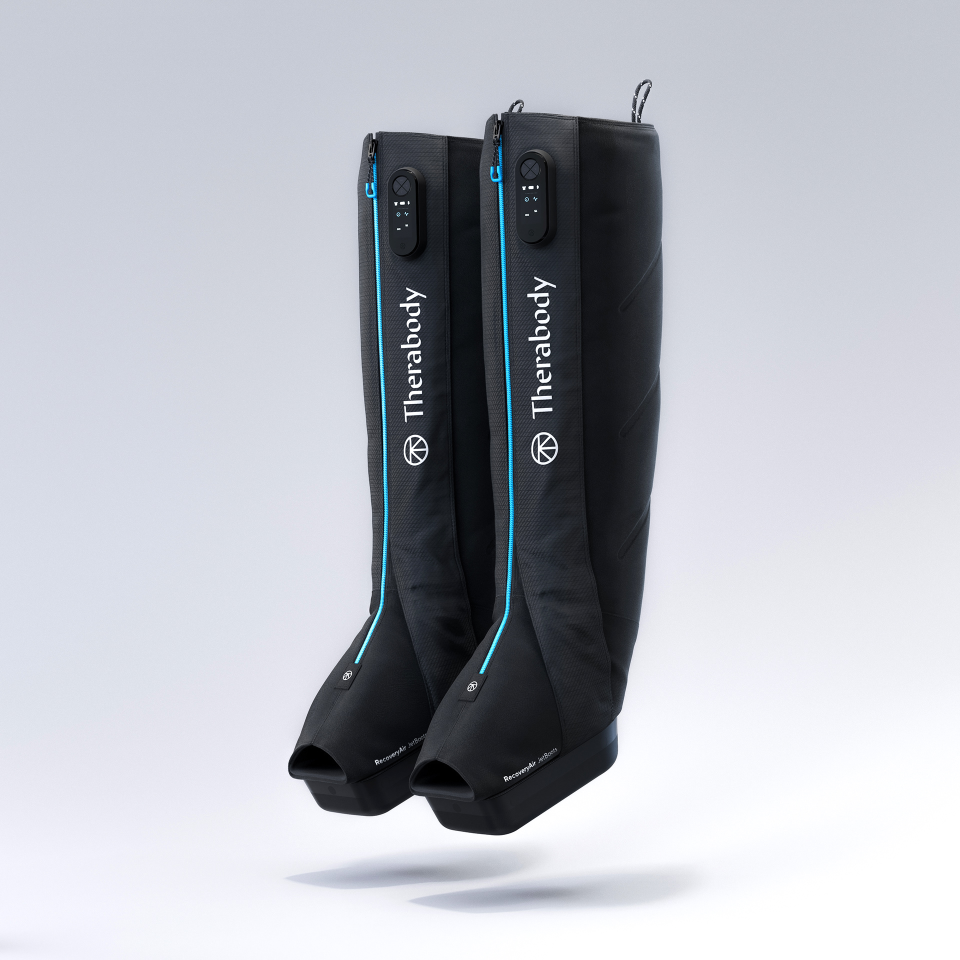 Two black recovery air jetboots with blue accents and Therabody branding on a white background.