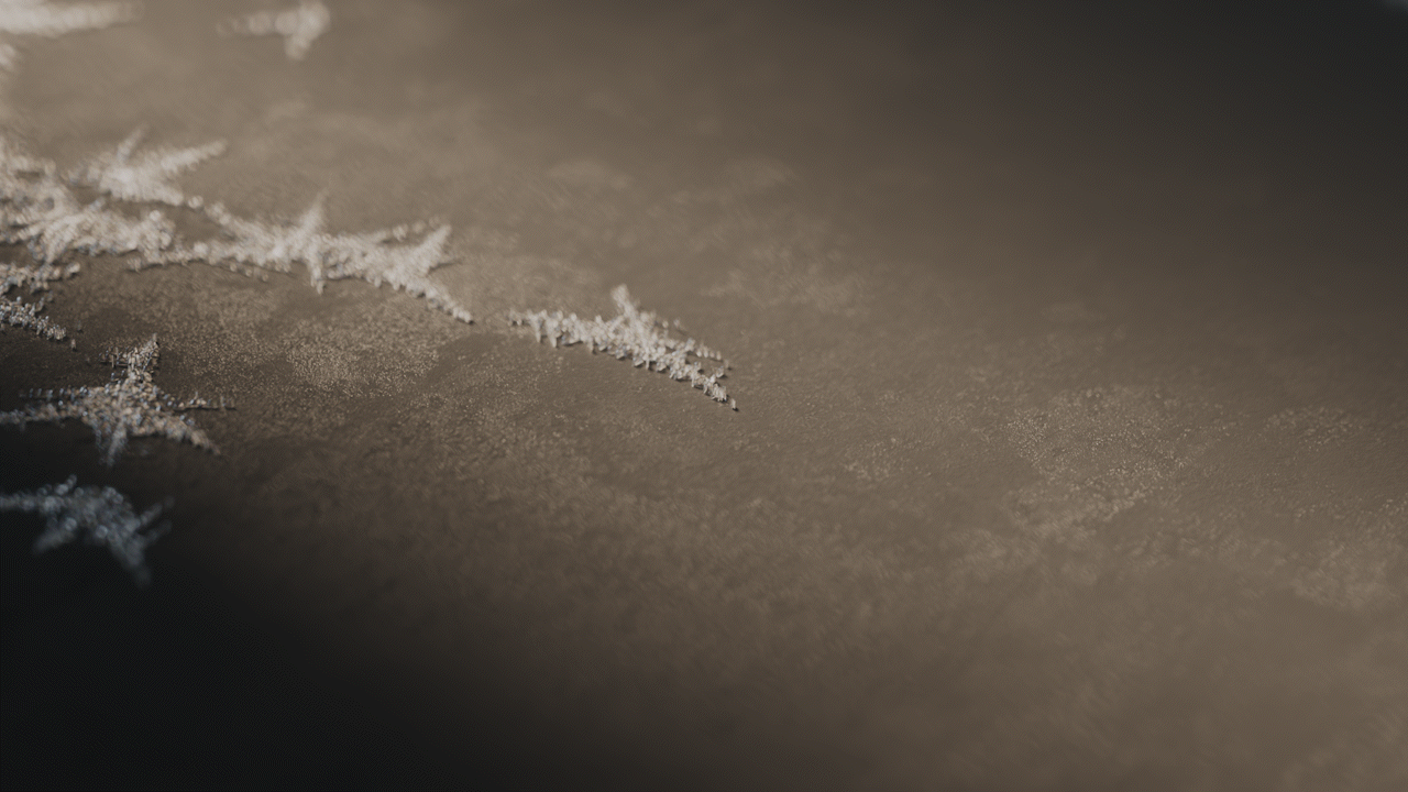 Animated sequence: A close-up of a textured surface with intricate patterns resembling snowflakes, showing detailed craftsmanship.