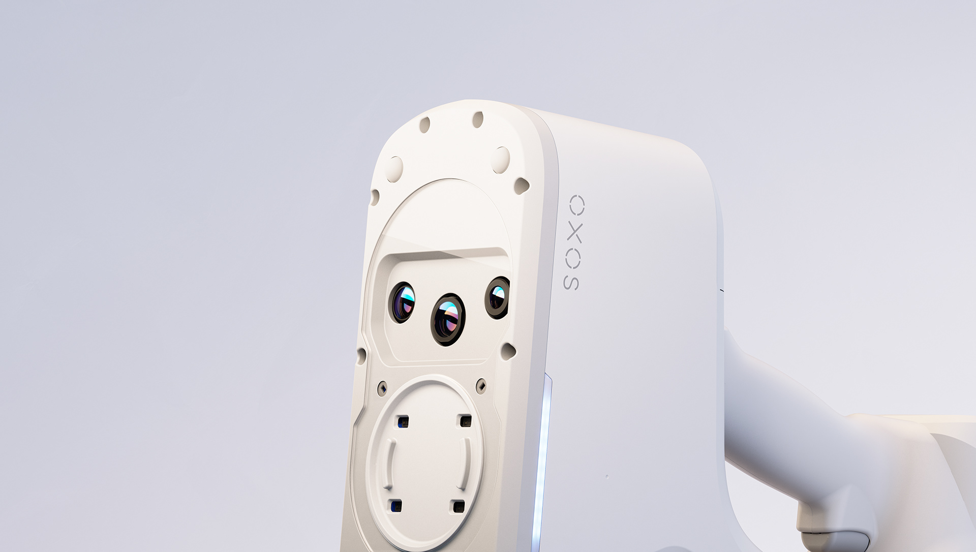 A sleek, white portable precision device with "OXOS" branding on its side, featuring circular ports and a small screen displaying colorful icons.