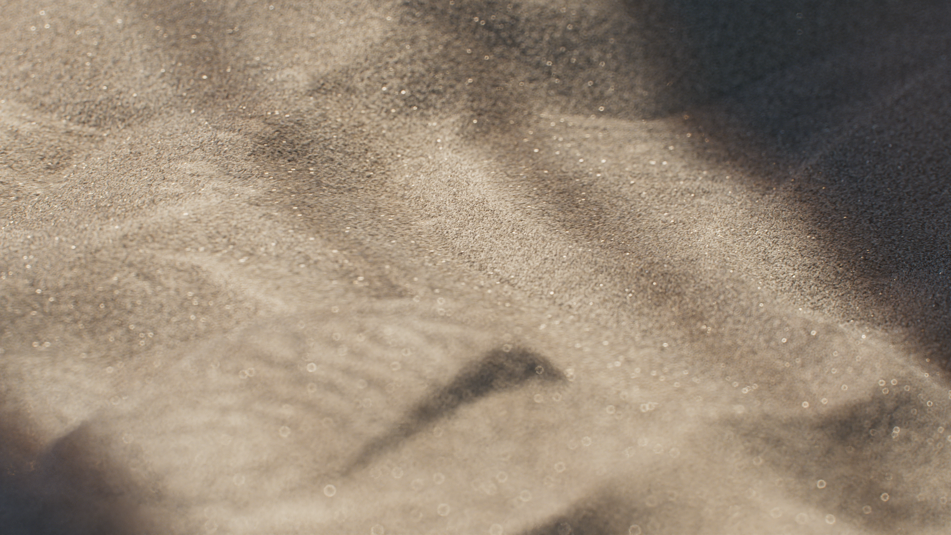 Animated sequence: A close-up of a textured surface with a pebble embedded, showing subtle light reflections and shadows.