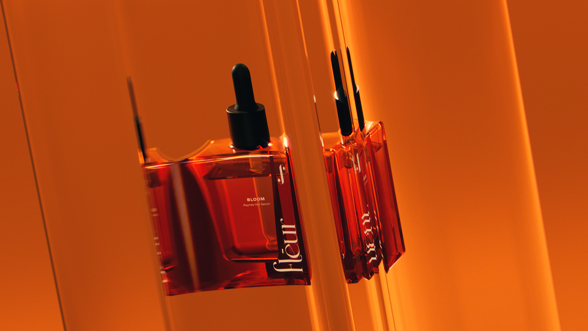 A red bottle of FLEUR BLOOM PEPTIDES serum with a dropper cap, set against an orange background, reflecting on a glossy surface.