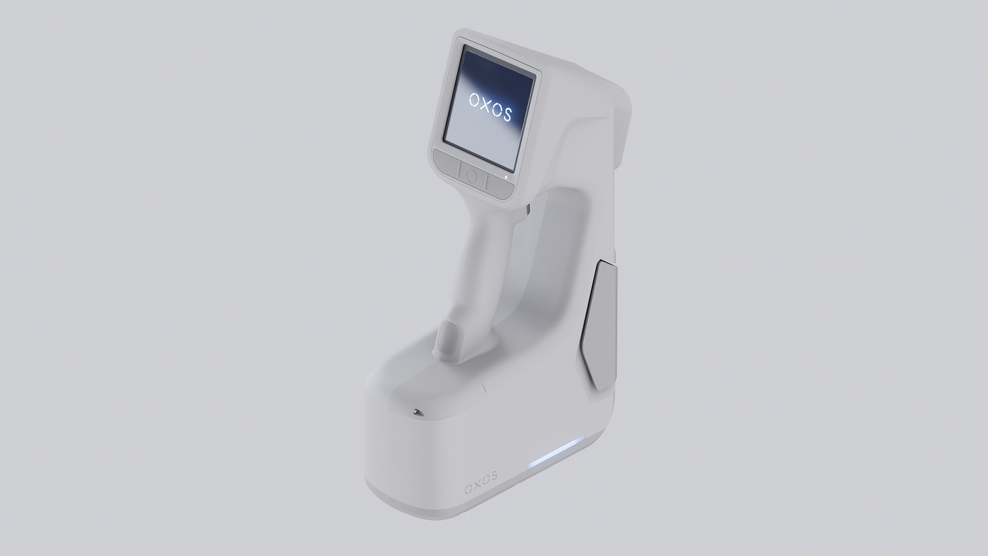 A sleek, white portable device with a digital display showing "OXOS" on its screen.