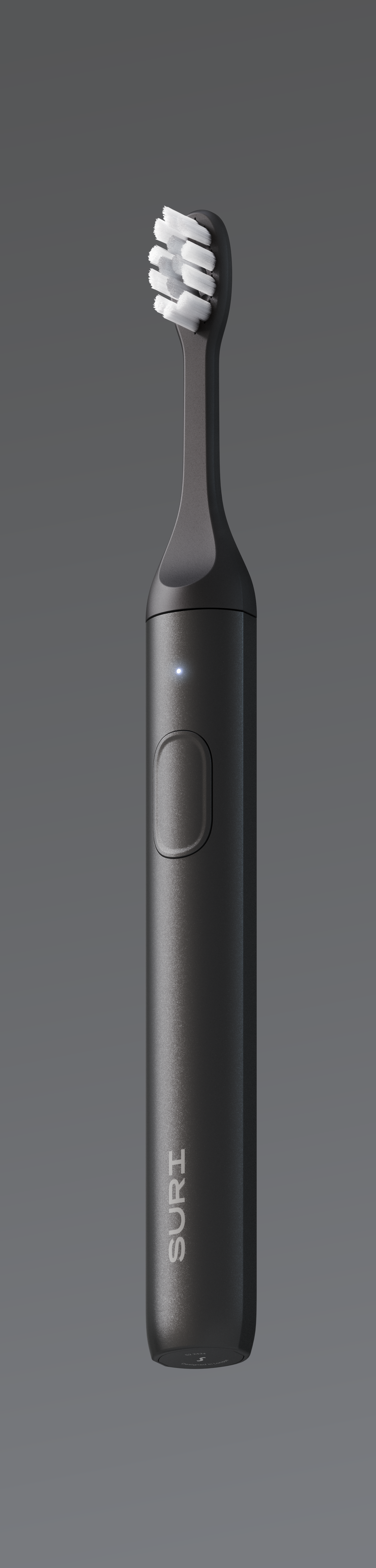 A black electric toothbrush with white bristles and a power button, labeled "SURI" on the handle.