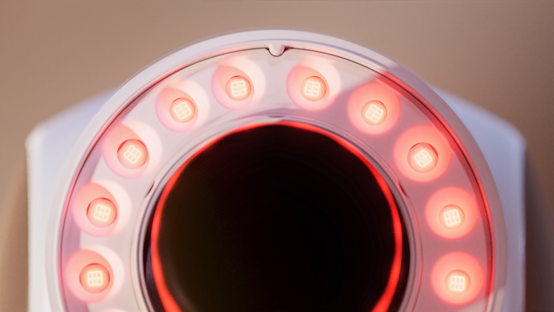 A close-up view of a red light therapy device with multiple circular LED lights around its perimeter.