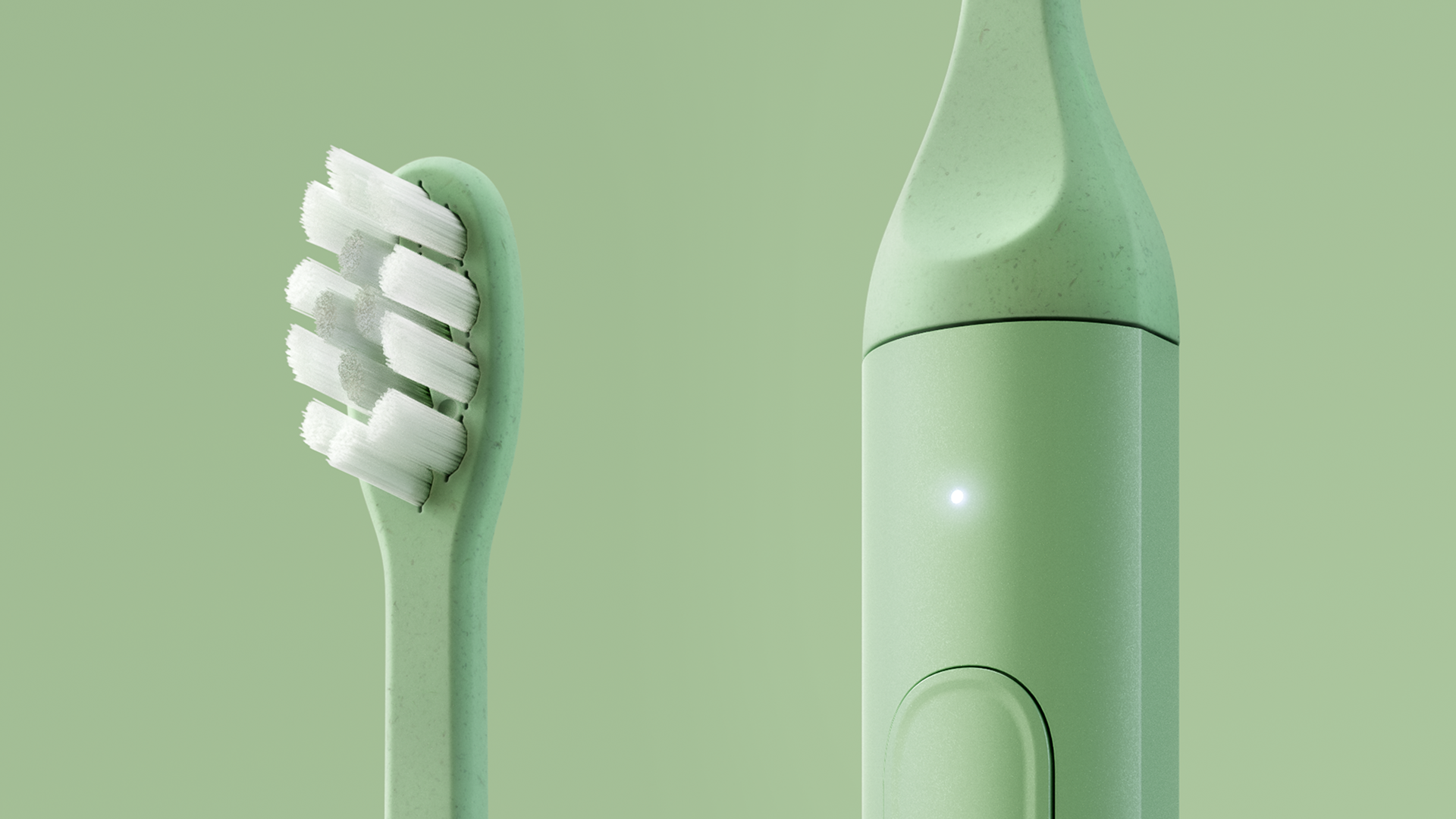 A mint green electric toothbrush with a sleek, modern design, featuring a soft bristle head and a compact handle with a power button.