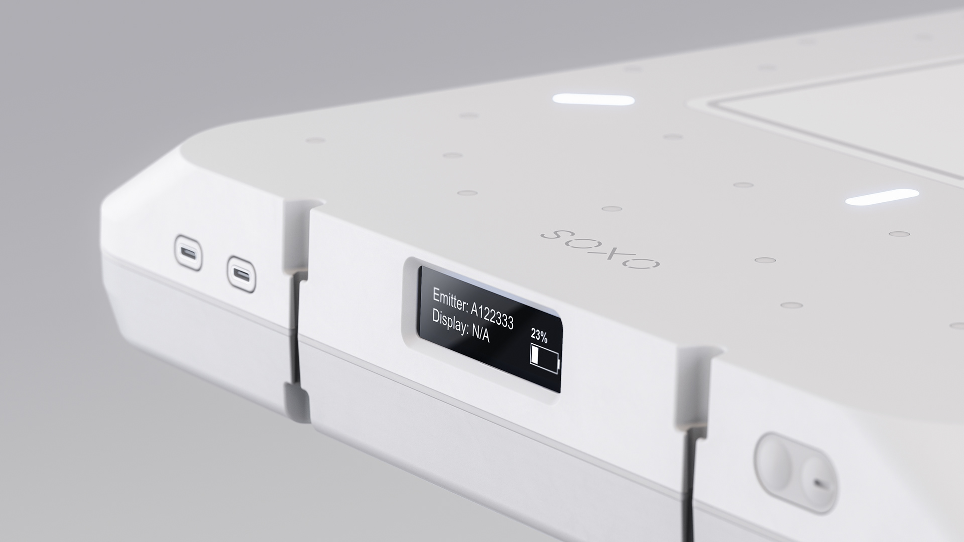 A sleek, white portable precision device with a display showing "Enter: A12333" and "Display: NA" on a gray background.