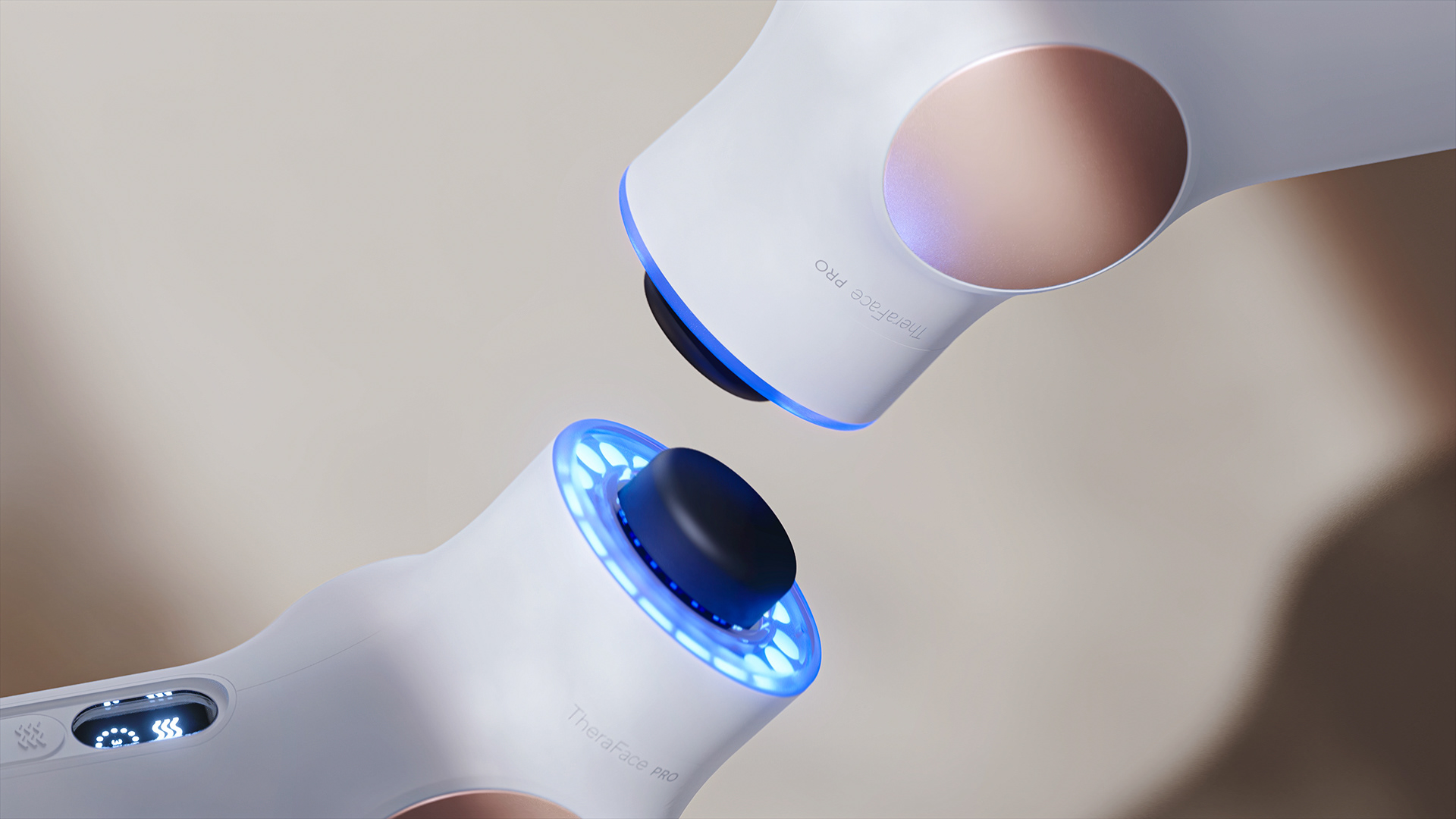 A sleek, white and blue device with a circular top and a glowing blue light on its side, labeled Therabody.