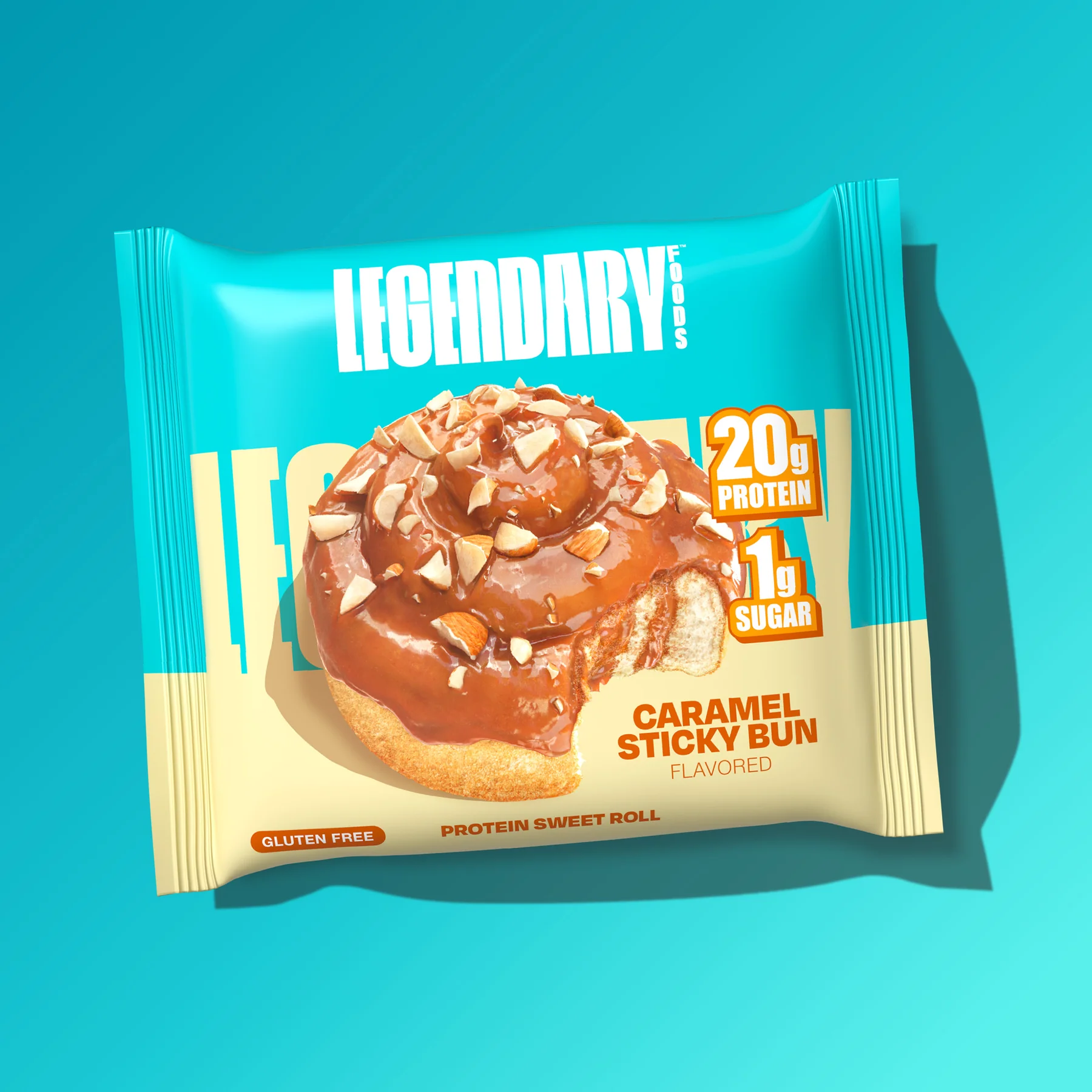 A caramel sticky bun protein sweet roll package with "LEGENDARY" branding, 20g protein, 1g sugar, gluten-free, and "Caramel Sticky Bun Flavored" text on a teal background.
