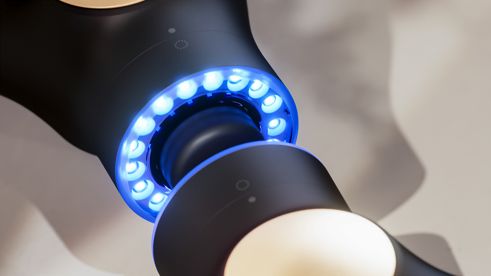 A close-up of a black device with blue LED lights.